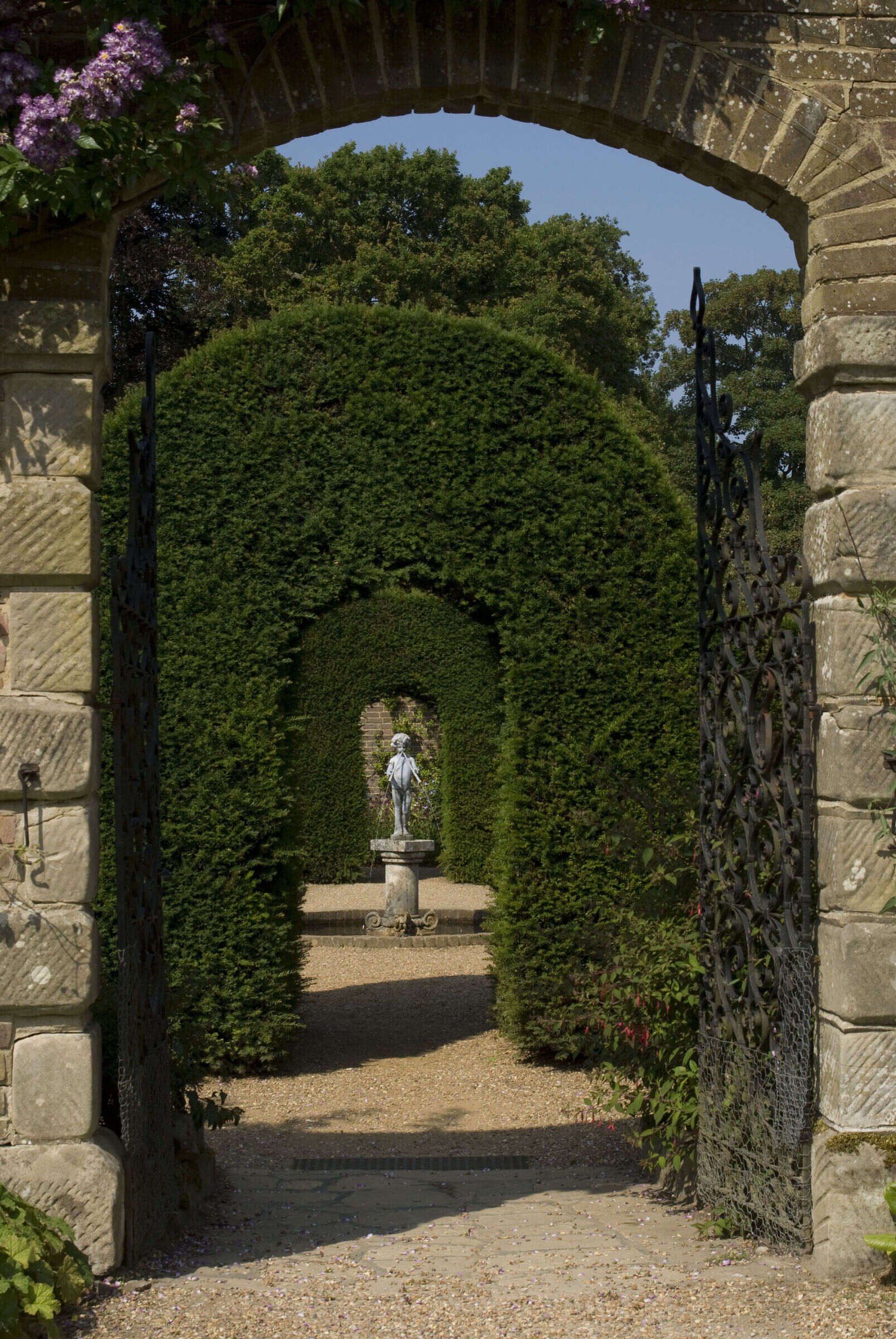 sussex-period-elizabethan-mansion-film-photo-shoot-location-unique-venue-hire-garden-stone-archway.jpg