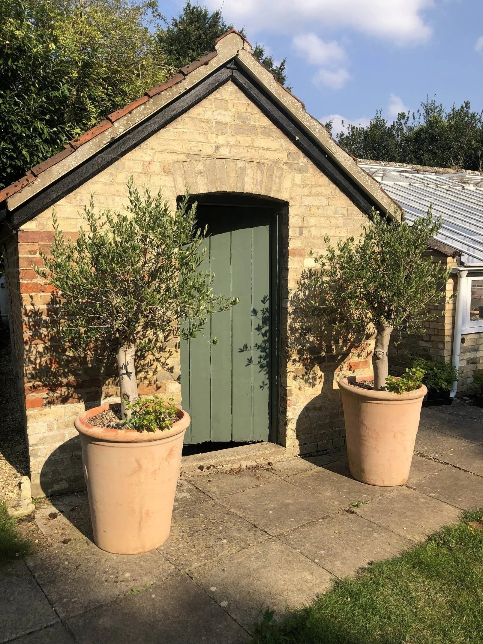 cambridgeshire-period-manor-house-film-photo-shoot-event-location-unique-venue-hire-olive-trees-brick-outhouse.jpg