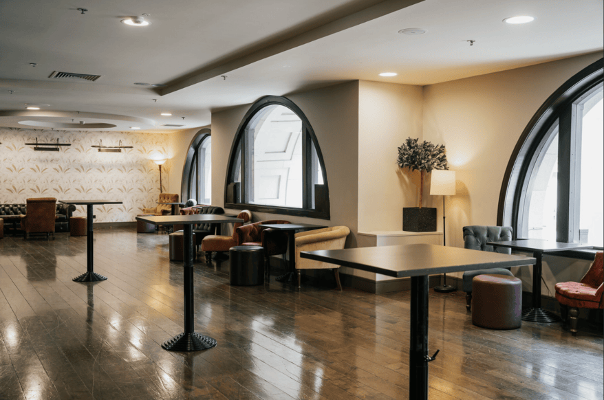 london-period-historic-art-deco-town-hall-film-photo-shoot-location-unique-venue-hire-square-cafe-style-tables.png