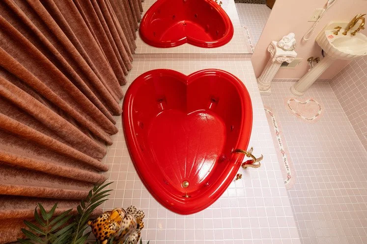 michigan-usa-kitsch-mid-century-house-film-photo-shoot-location-unique-venue-hire-red-heart-shaped-bath.jpg