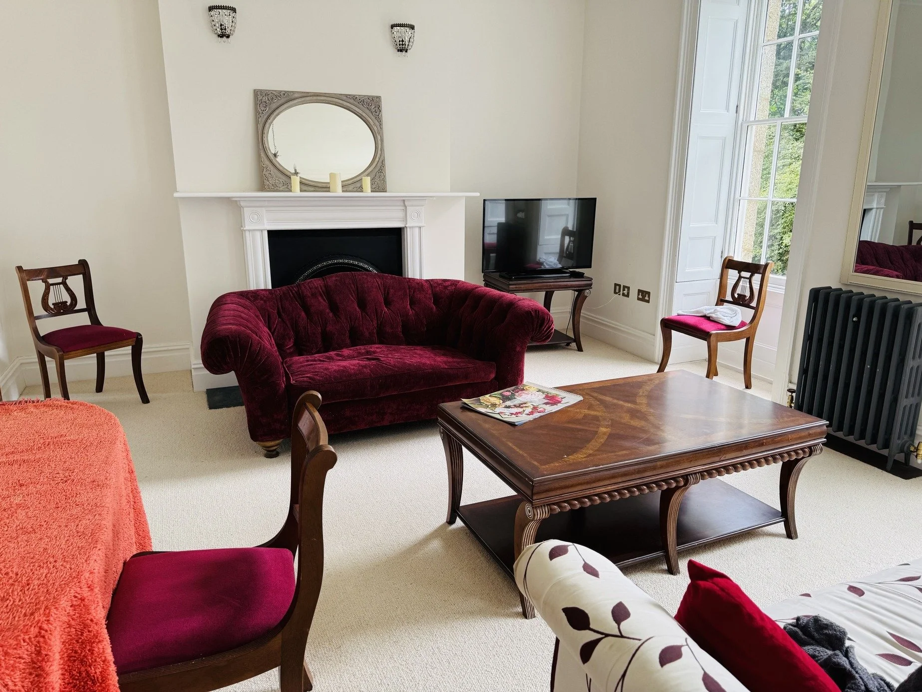 cornwall-historic-regency-country-house-film-photo-shoot-event-location-unique-venue-hire-red-sofa.jpg