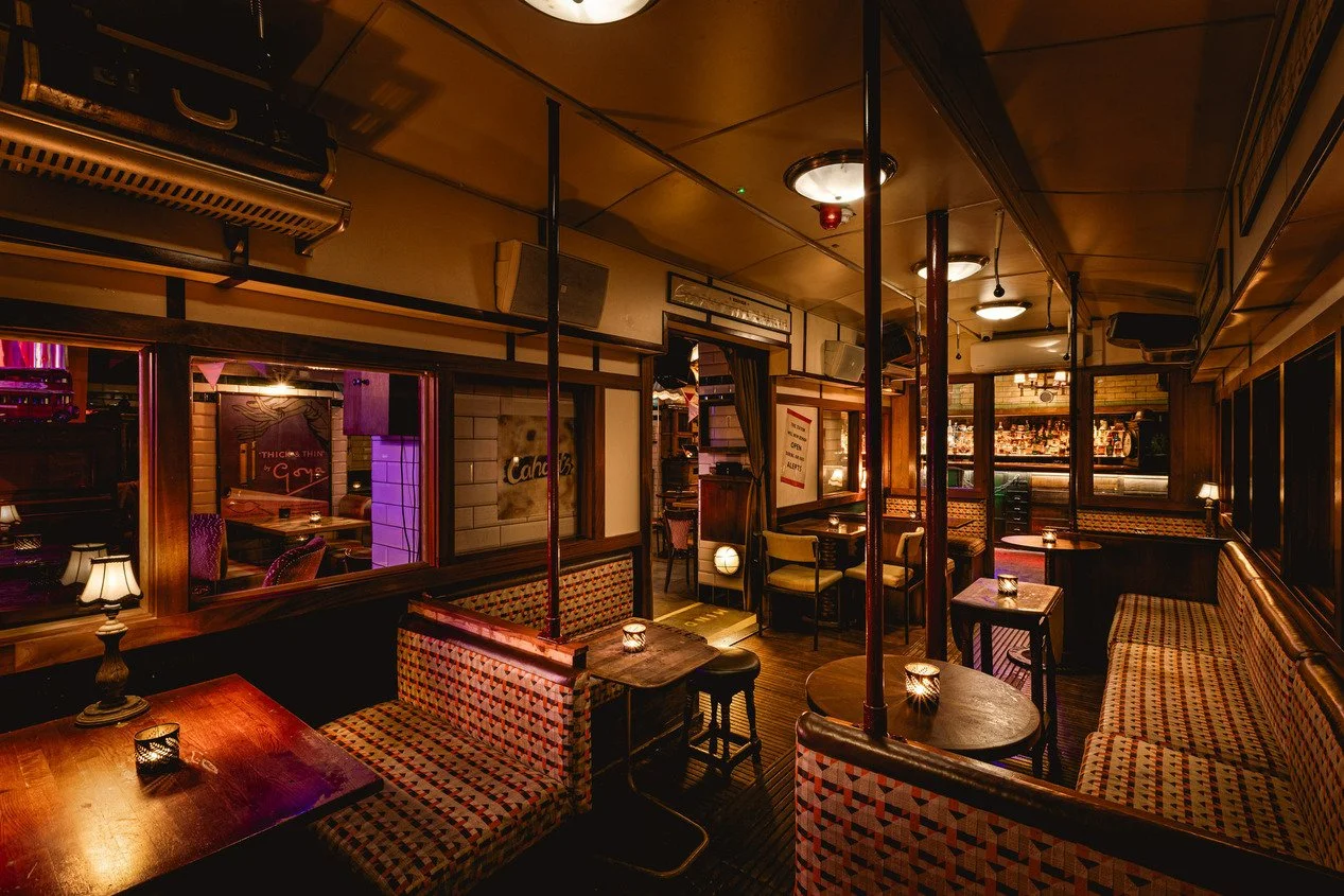 london-1940s-underground-station-immersive-events-film-photo-shoot-location-hire-carriage-round-tables.jpg