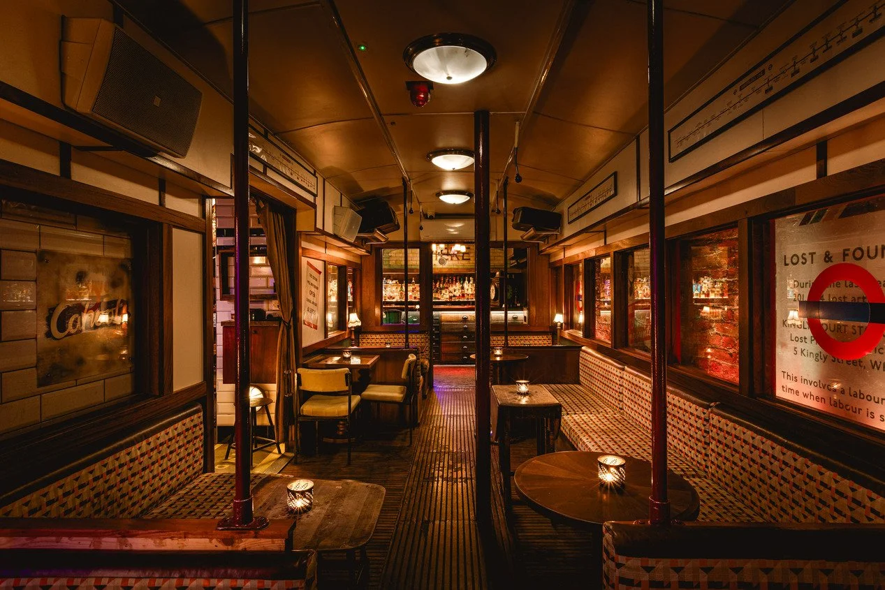london-1940s-underground-station-immersive-events-film-photo-shoot-location-hire-carriage-tables.jpg