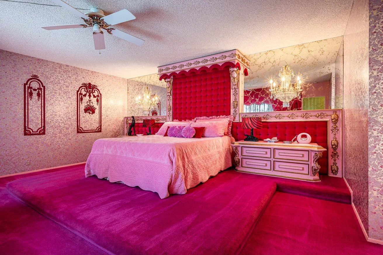 Pink and Red bedroom with ceiling fan