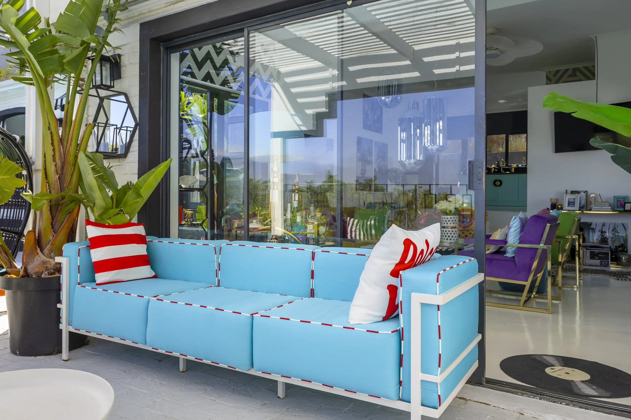hire-a-cape-town-mid-century-maximalist-villa-film-photo-shoot-event-location-blue-outdoor-sofa.jpg