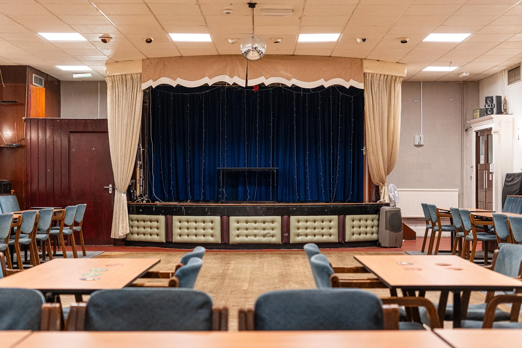 hire-a-london-1970s-traditional-working-mens-club-film-photo-shoot-event-location-stage-curtains.jpg