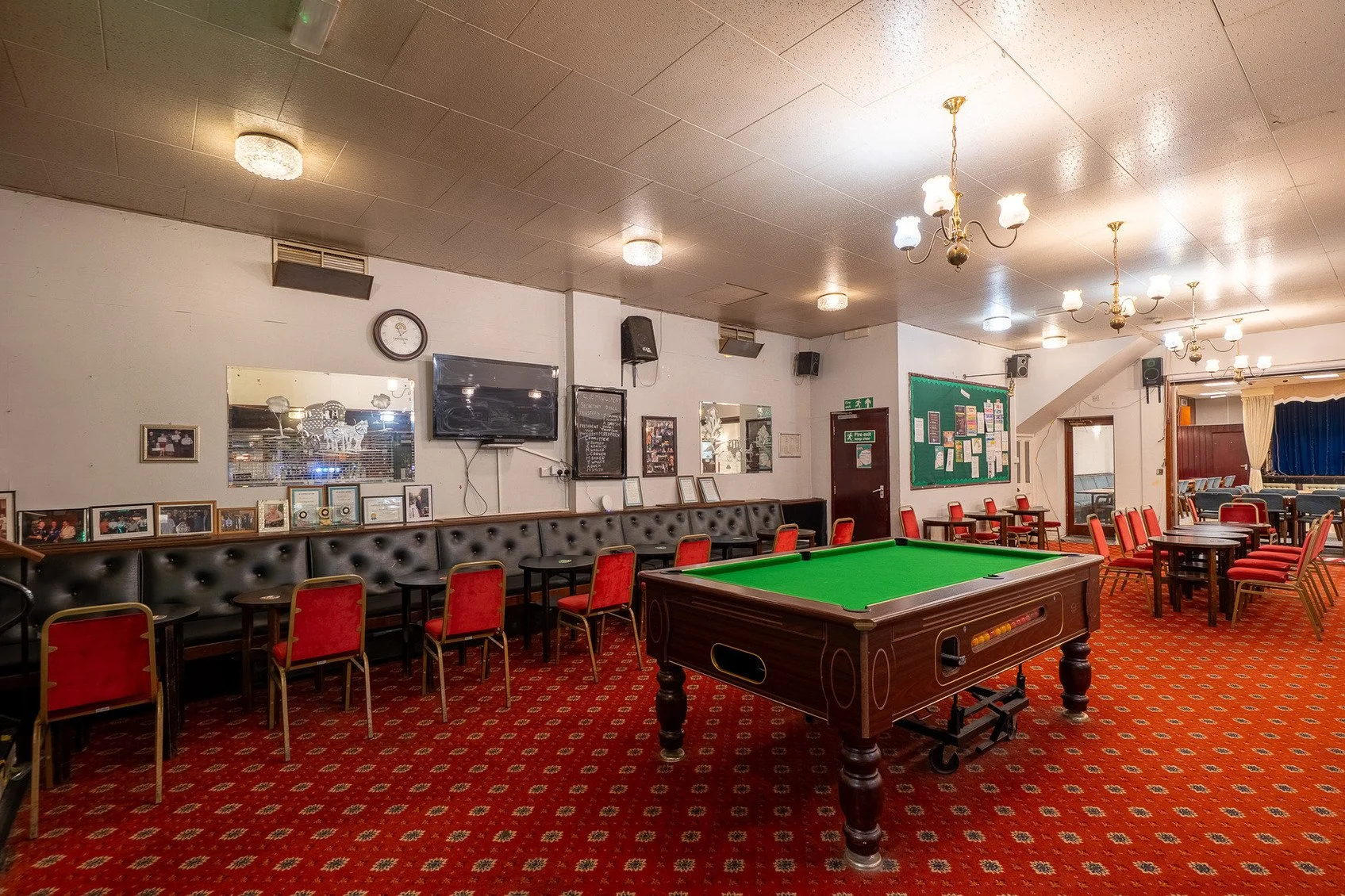 hire-a-london-1970s-traditional-working-mens-club-film-photo-shoot-event-location-banquette-red-chairs.jpg