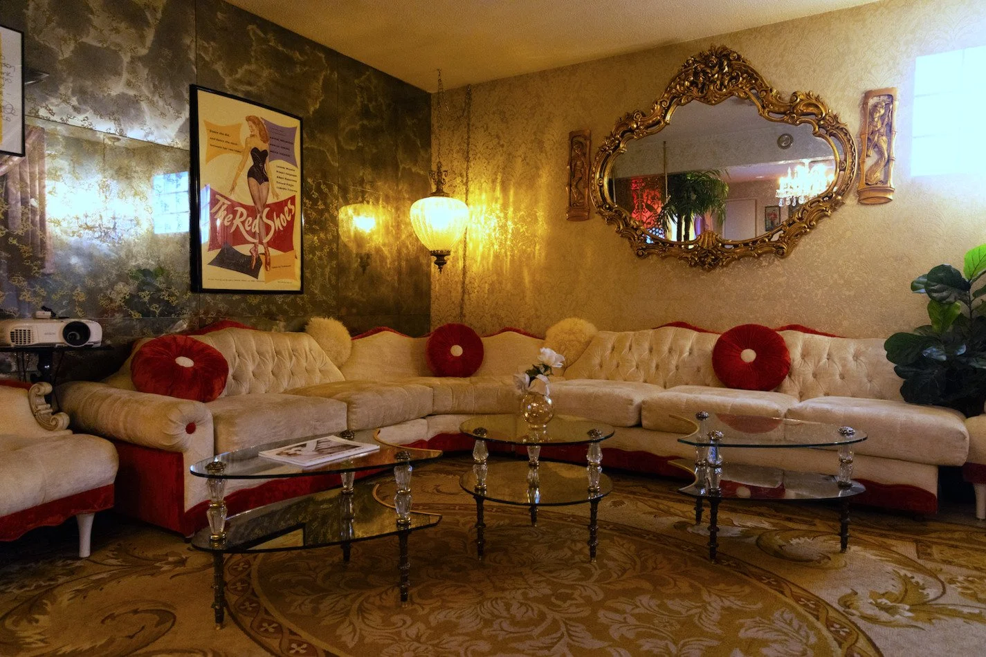 Cream corner sofa with mirror on wall above