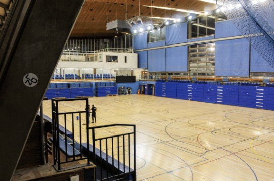 south-east-london-brutalist-sports-centre-filming-photoshoots-events-hall-wooden-floor.png
