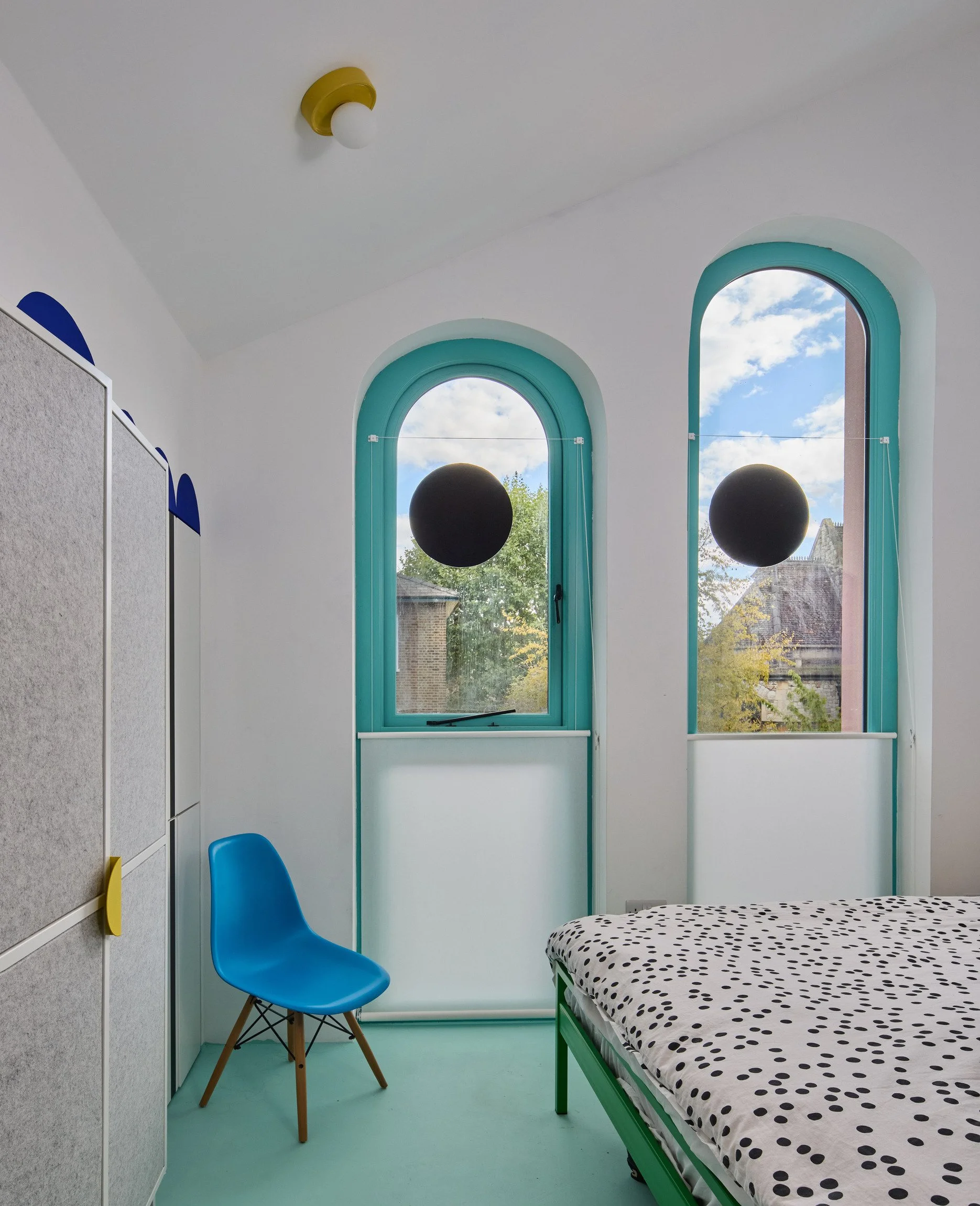 london-pink-wes-anderson-style-colourful-house-roof-terrace-filming-photoshoots-bedroom-windows.jpg