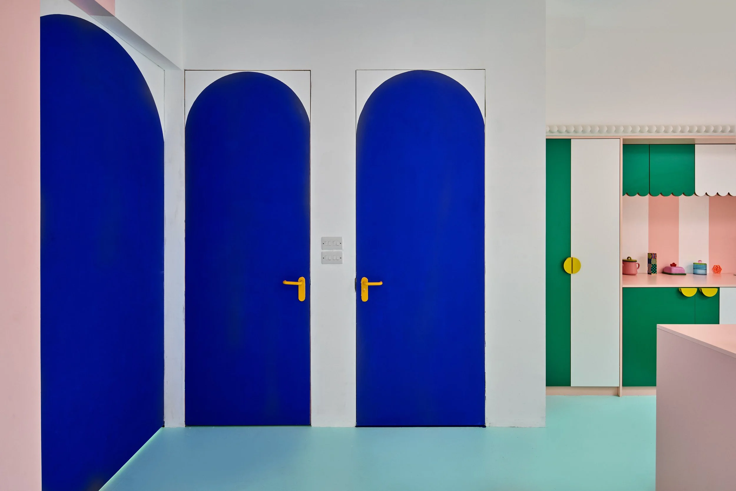 london-pink-wes-anderson-style-colourful-house-roof-terrace-filming-photoshoots-blue-doors.jpg
