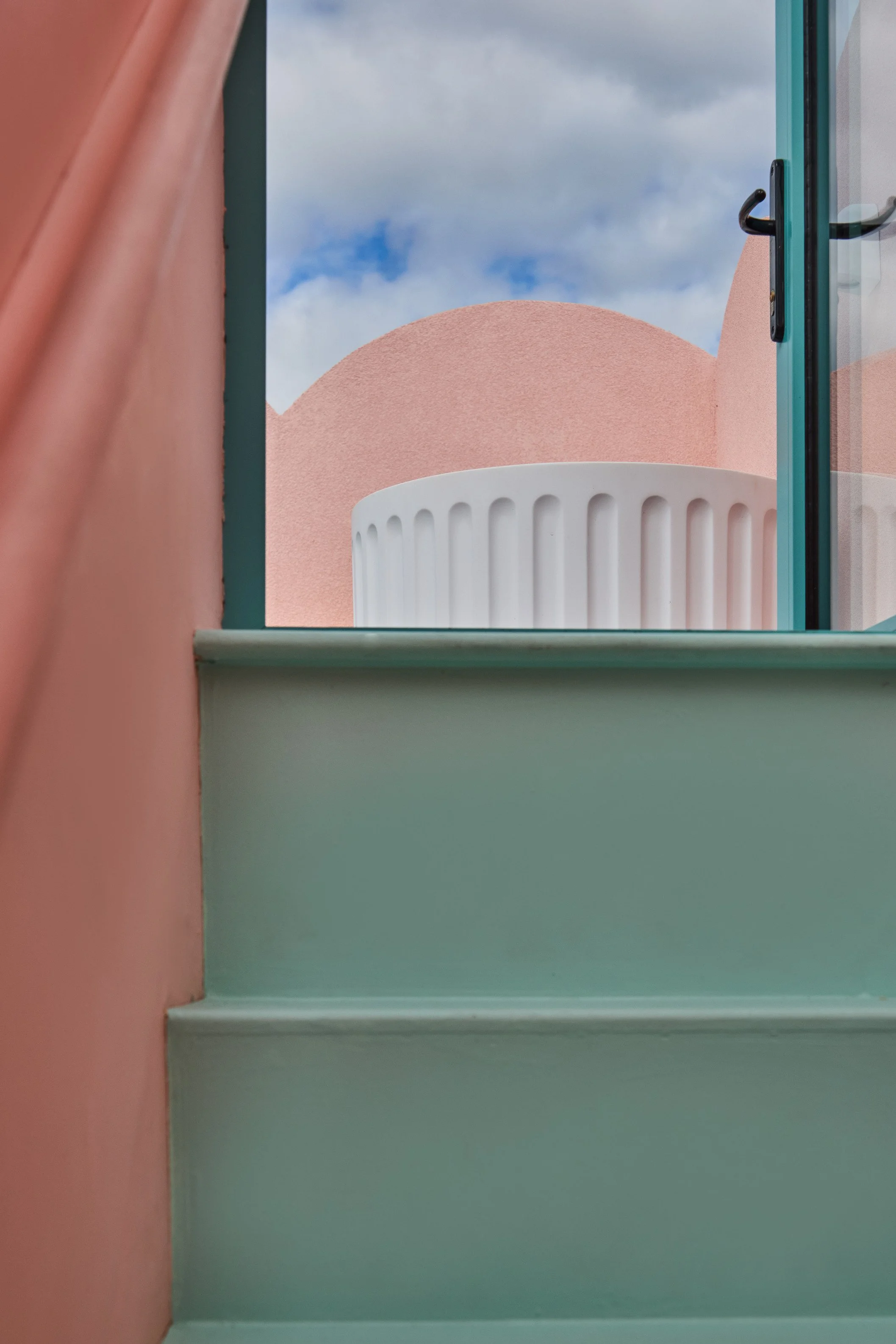 london-pink-wes-anderson-style-colourful-house-roof-terrace-filming-photoshoots-doorway.jpg