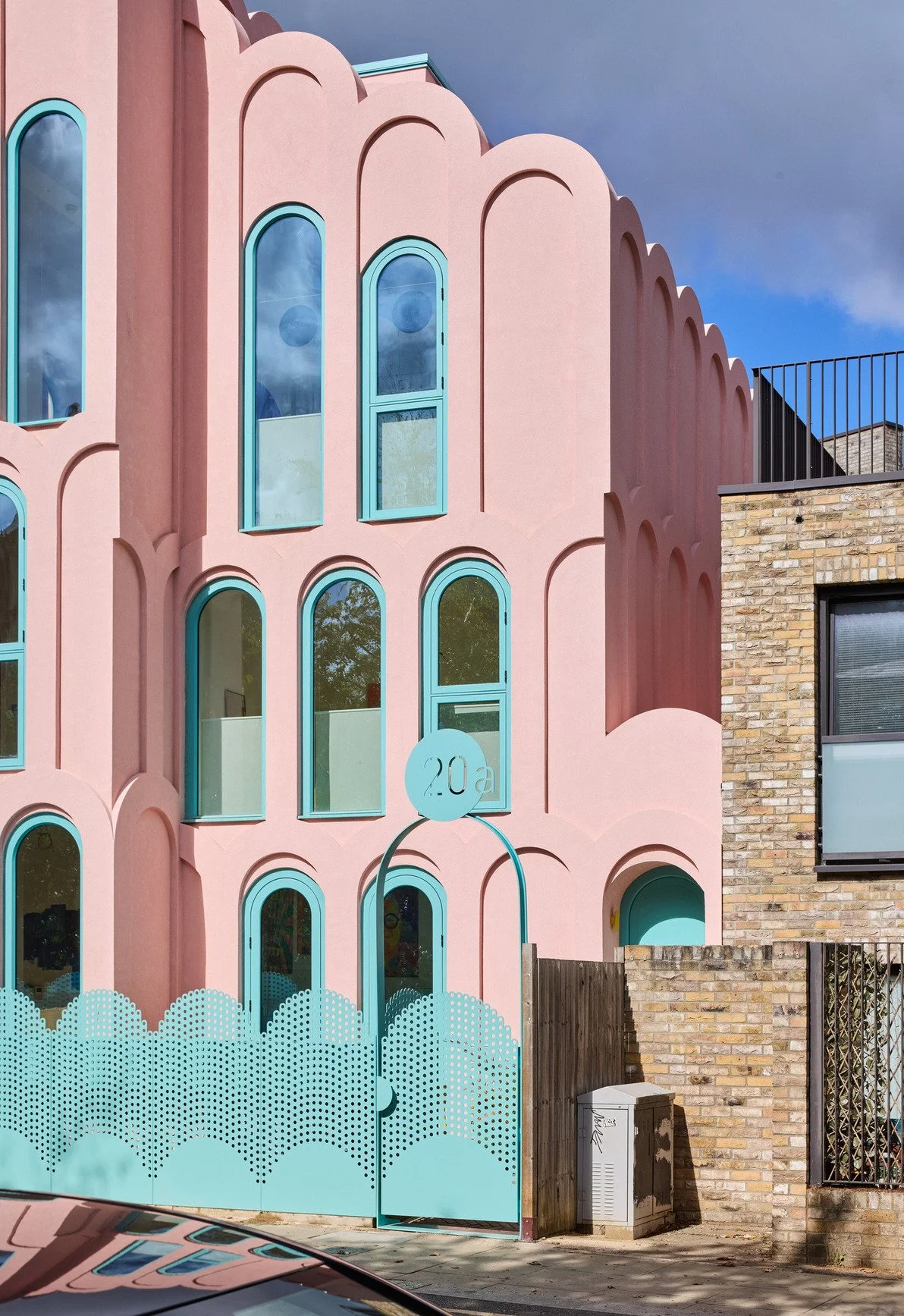 london-pink-wes-anderson-style-colourful-house-roof-terrace-filming-photoshoots-facade-arches.jpg
