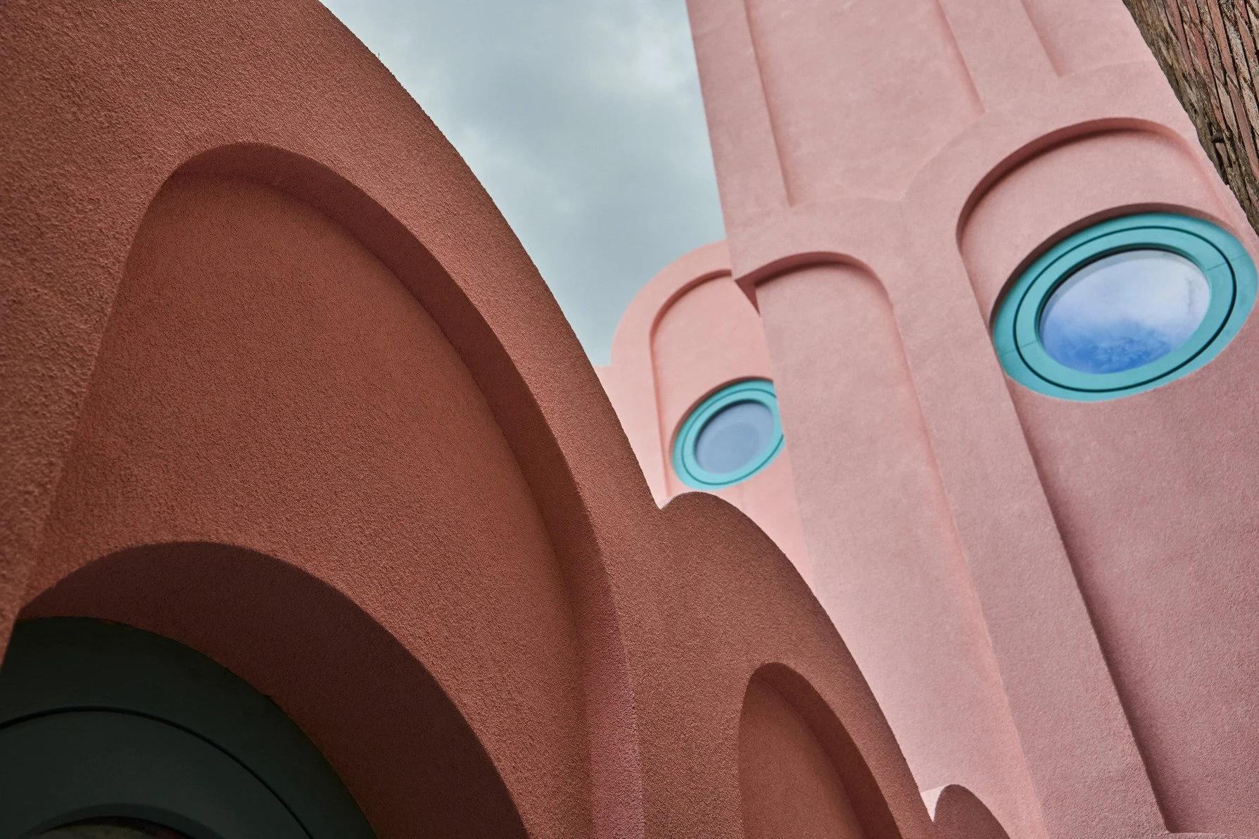 london-pink-wes-anderson-style-colourful-house-roof-terrace-filming-photoshoots-green-circular-windows.jpg