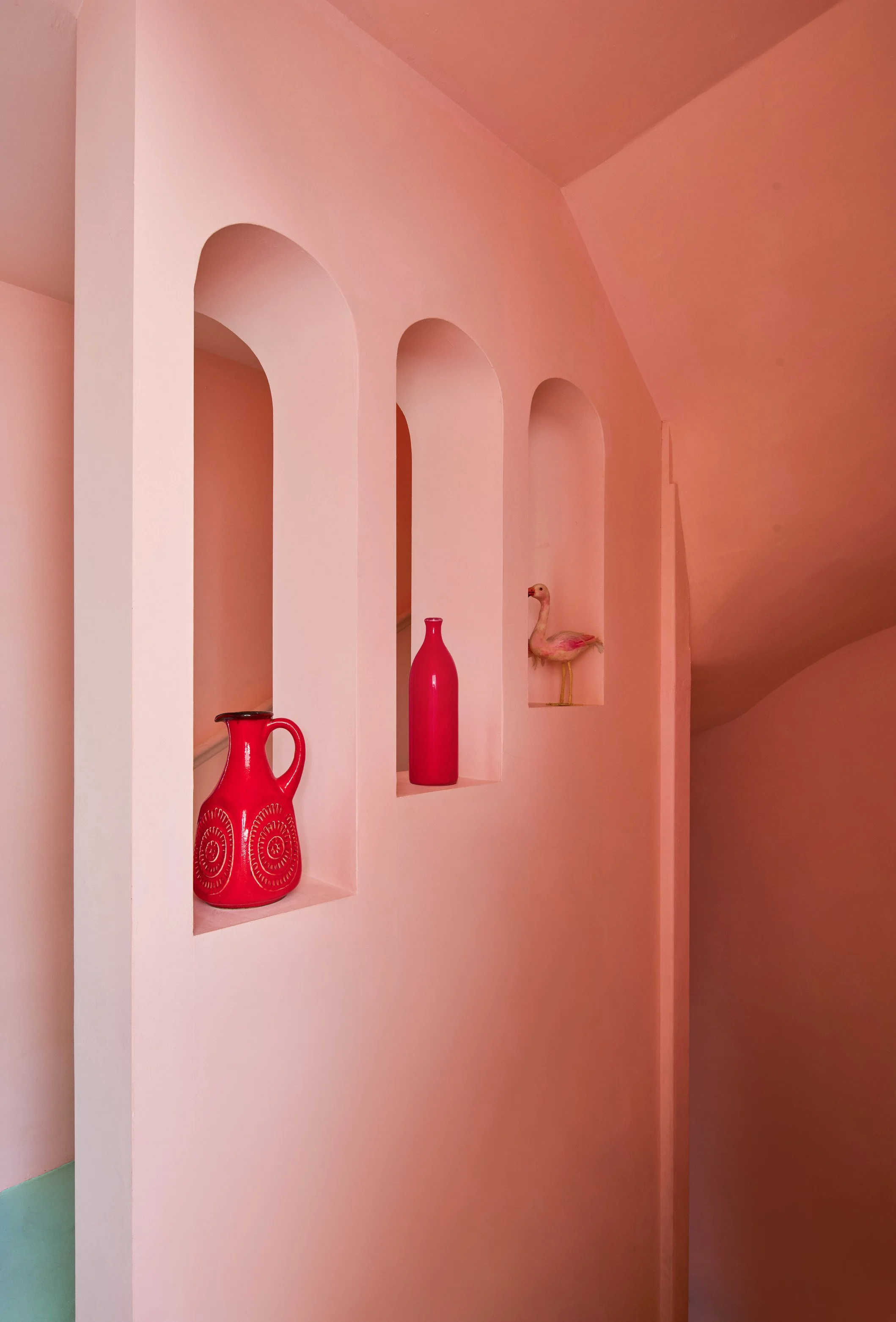 london-pink-wes-anderson-style-colourful-house-roof-terrace-filming-photoshoots-hallway-arches.jpg