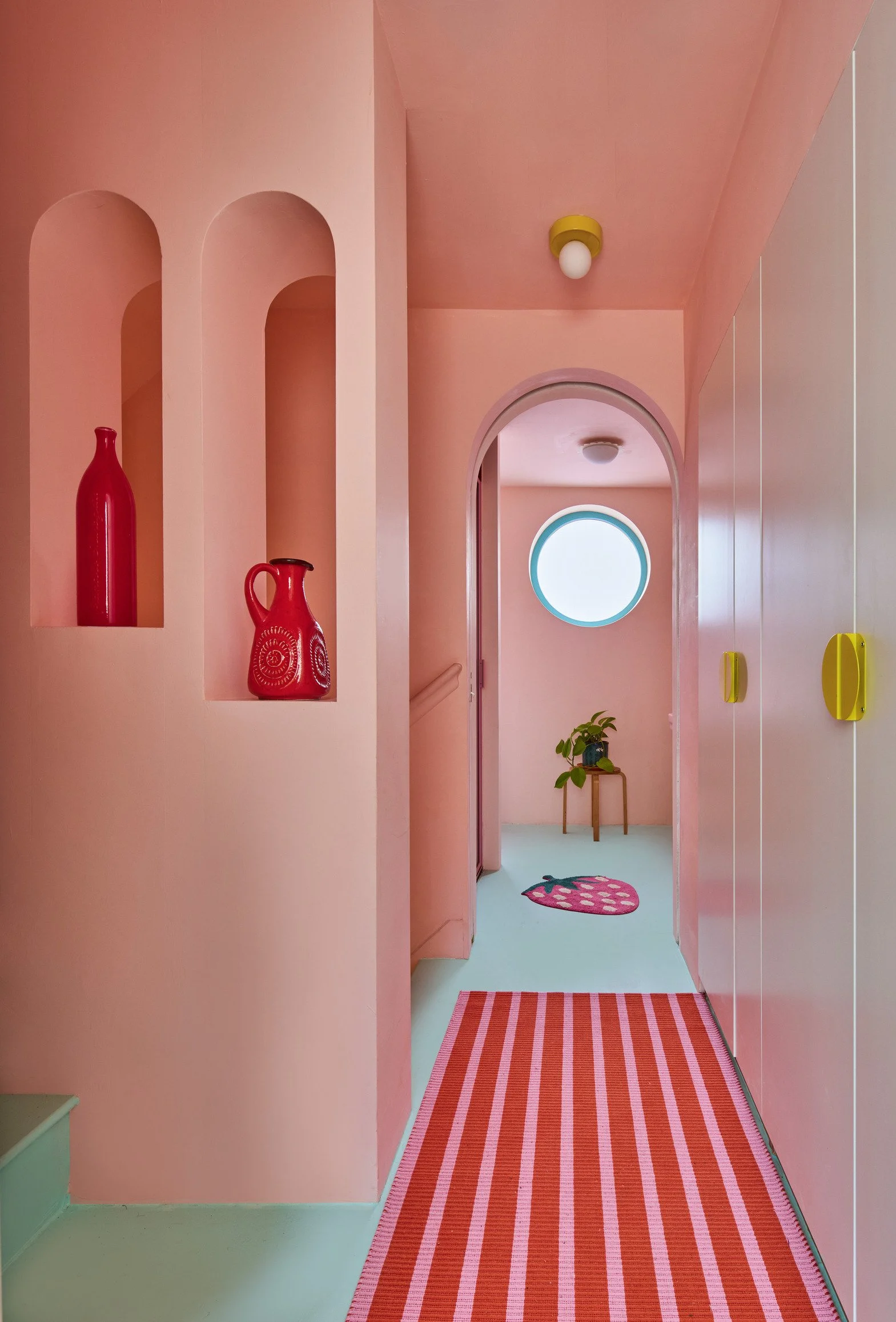 london-pink-wes-anderson-style-colourful-house-roof-terrace-filming-photoshoots-red-vases.jpg