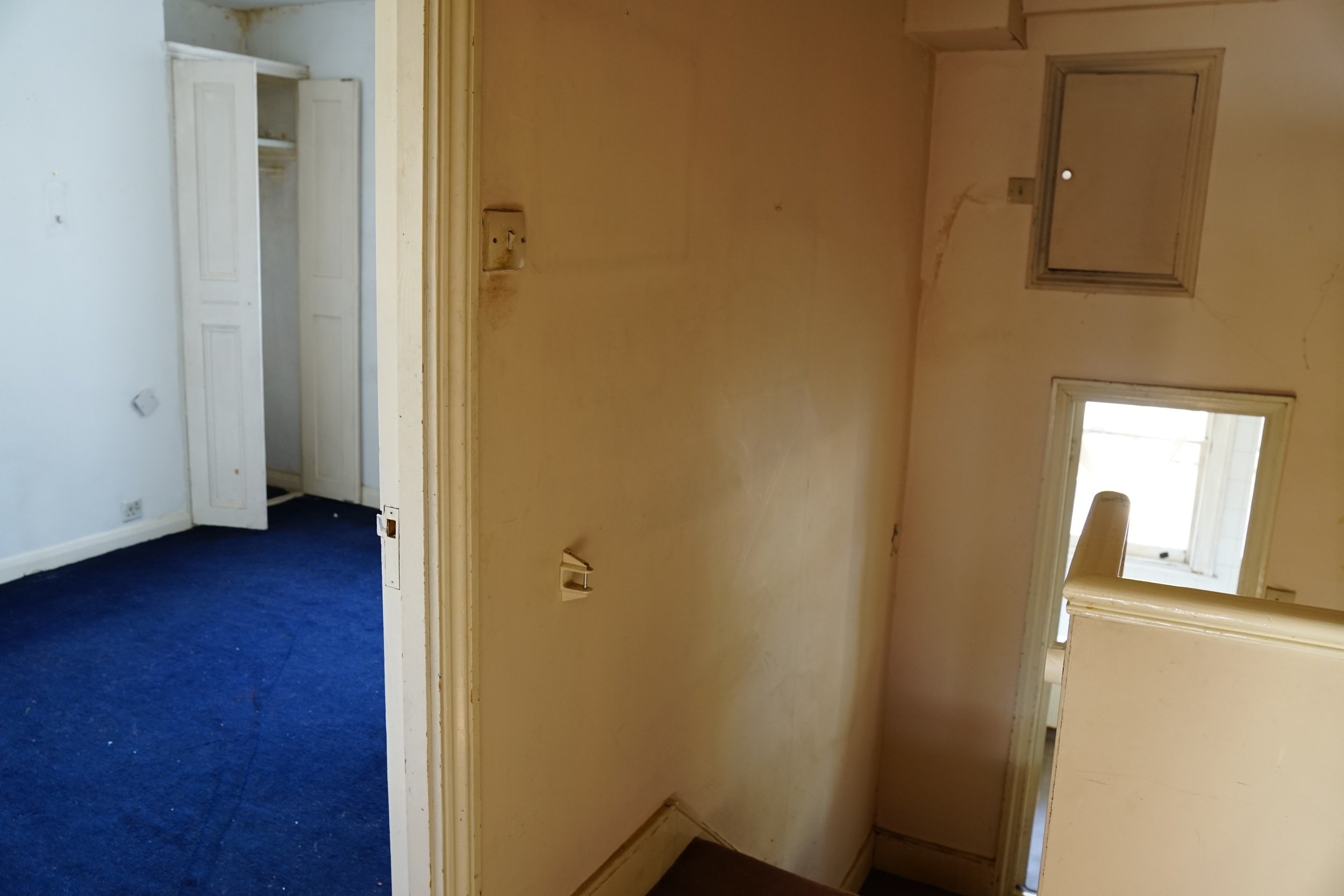 london-retro-distressed-white-stucco-terraced-house-unmodernised-filming-photoshoots-events-blue-carpet.jpg