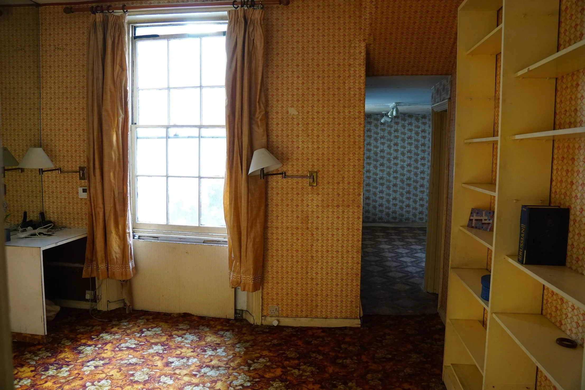 london-retro-distressed-white-stucco-terraced-house-unmodernised-filming-photoshoots-events-book-shelves.jpg