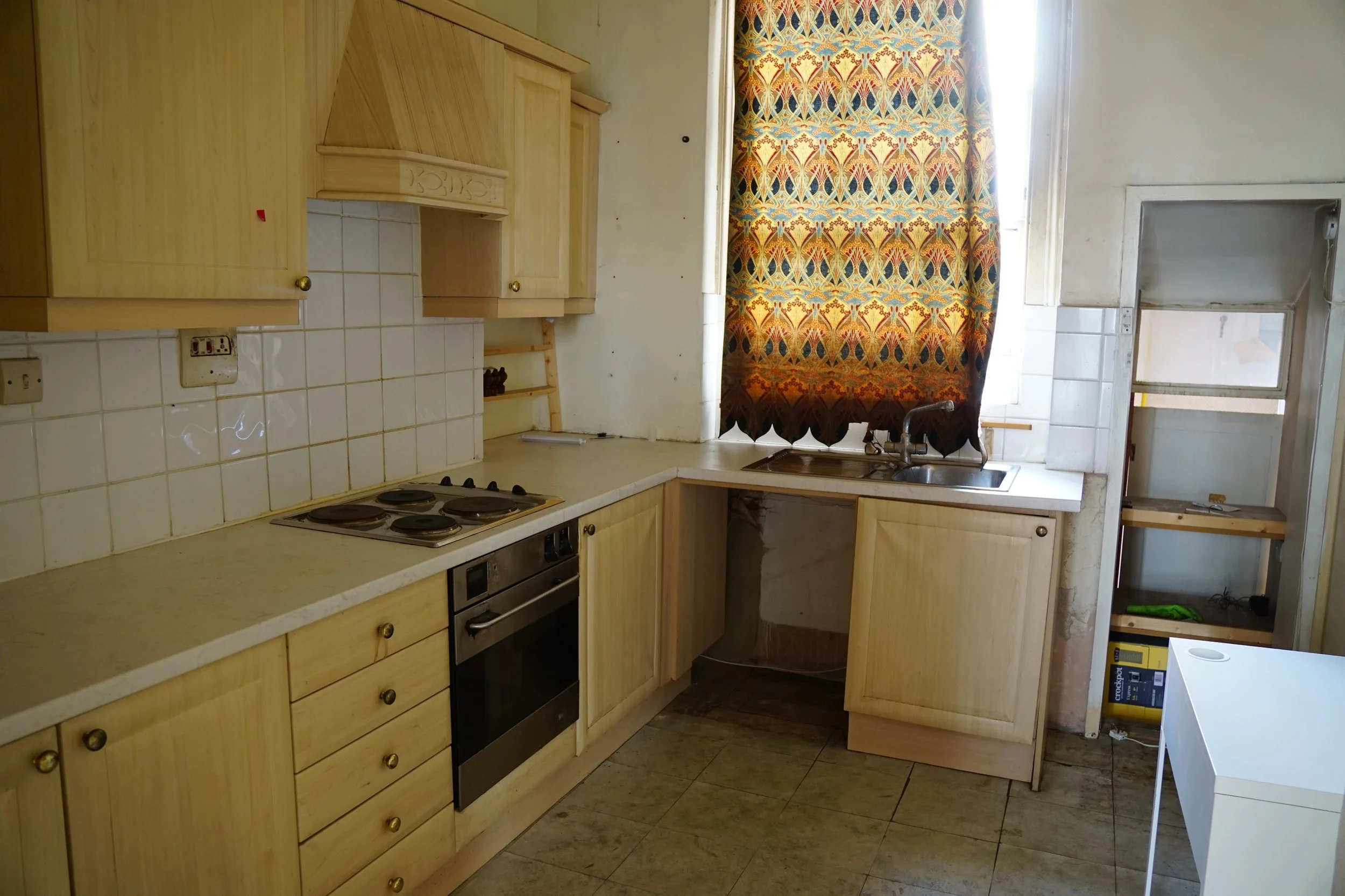 london-retro-distressed-white-stucco-terraced-house-unmodernised-filming-photoshoots-events-kitchen-blinds.jpg