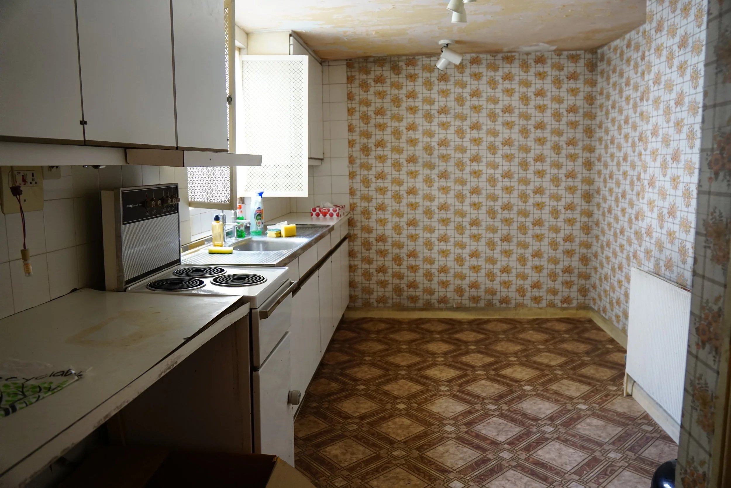 london-retro-distressed-white-stucco-terraced-house-unmodernised-filming-photoshoots-events-kitchen-units.jpg