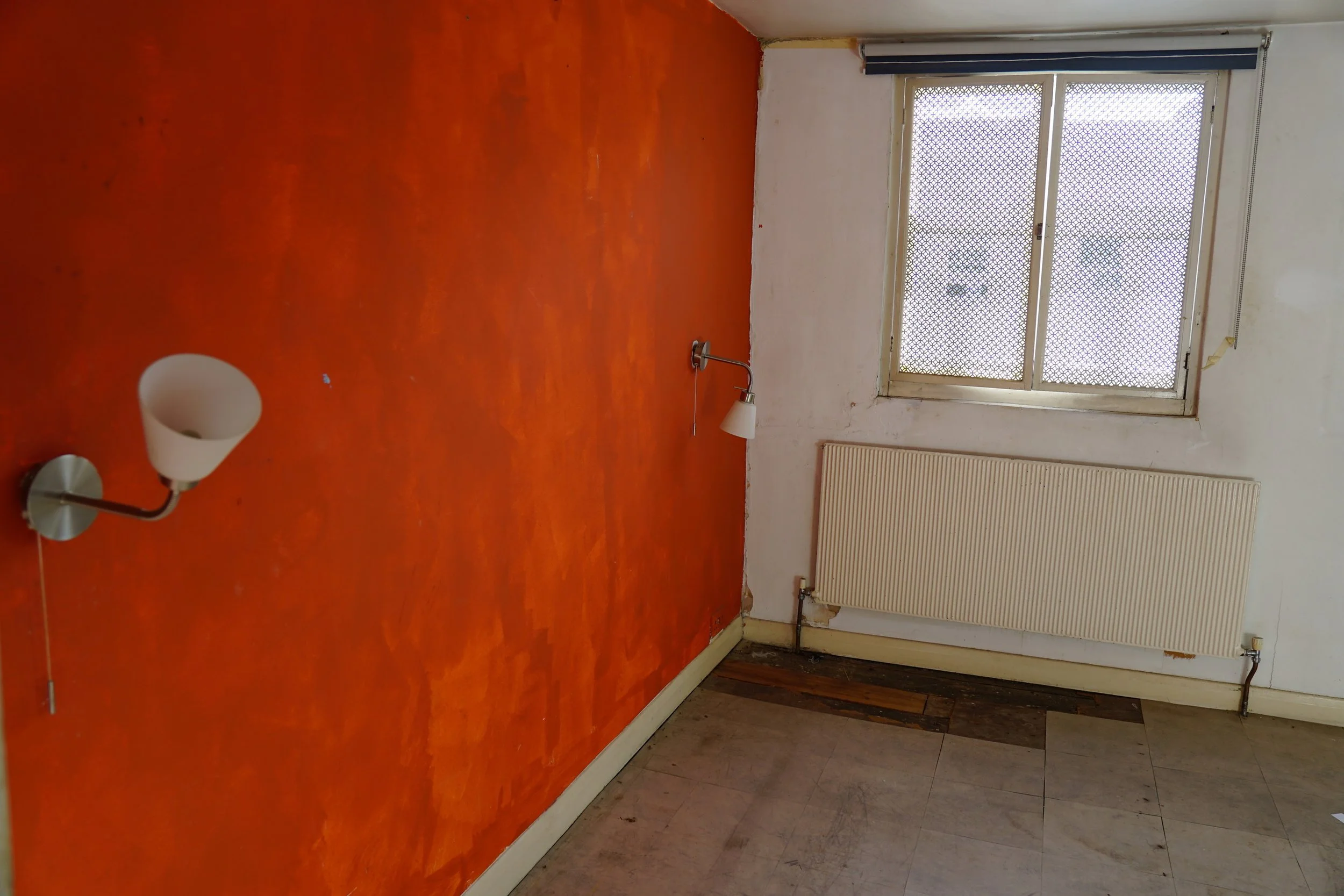london-retro-distressed-white-stucco-terraced-house-unmodernised-filming-photoshoots-events-orange-walls.jpg