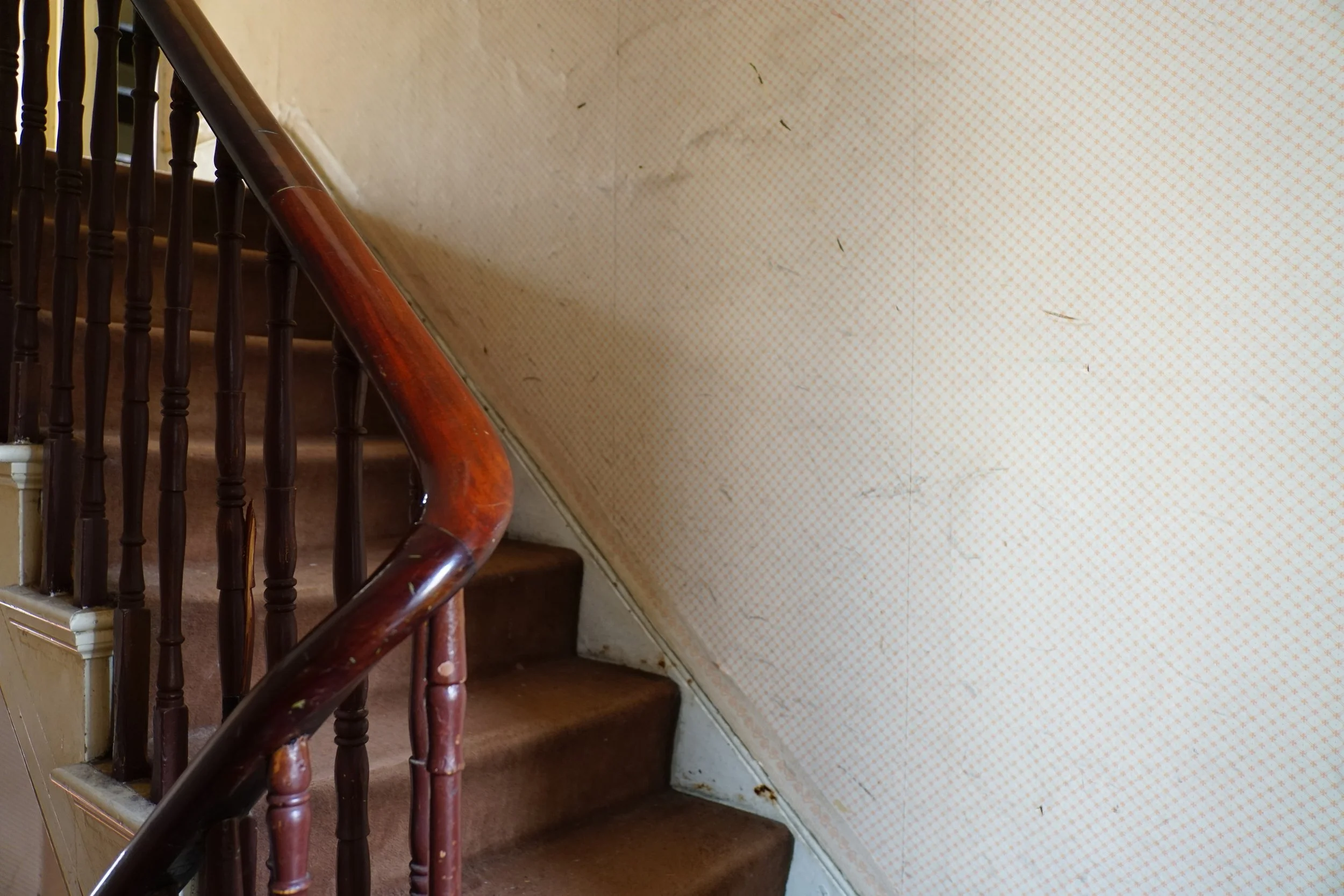 london-retro-distressed-white-stucco-terraced-house-unmodernised-filming-photoshoots-events-stair-banisters.jpg