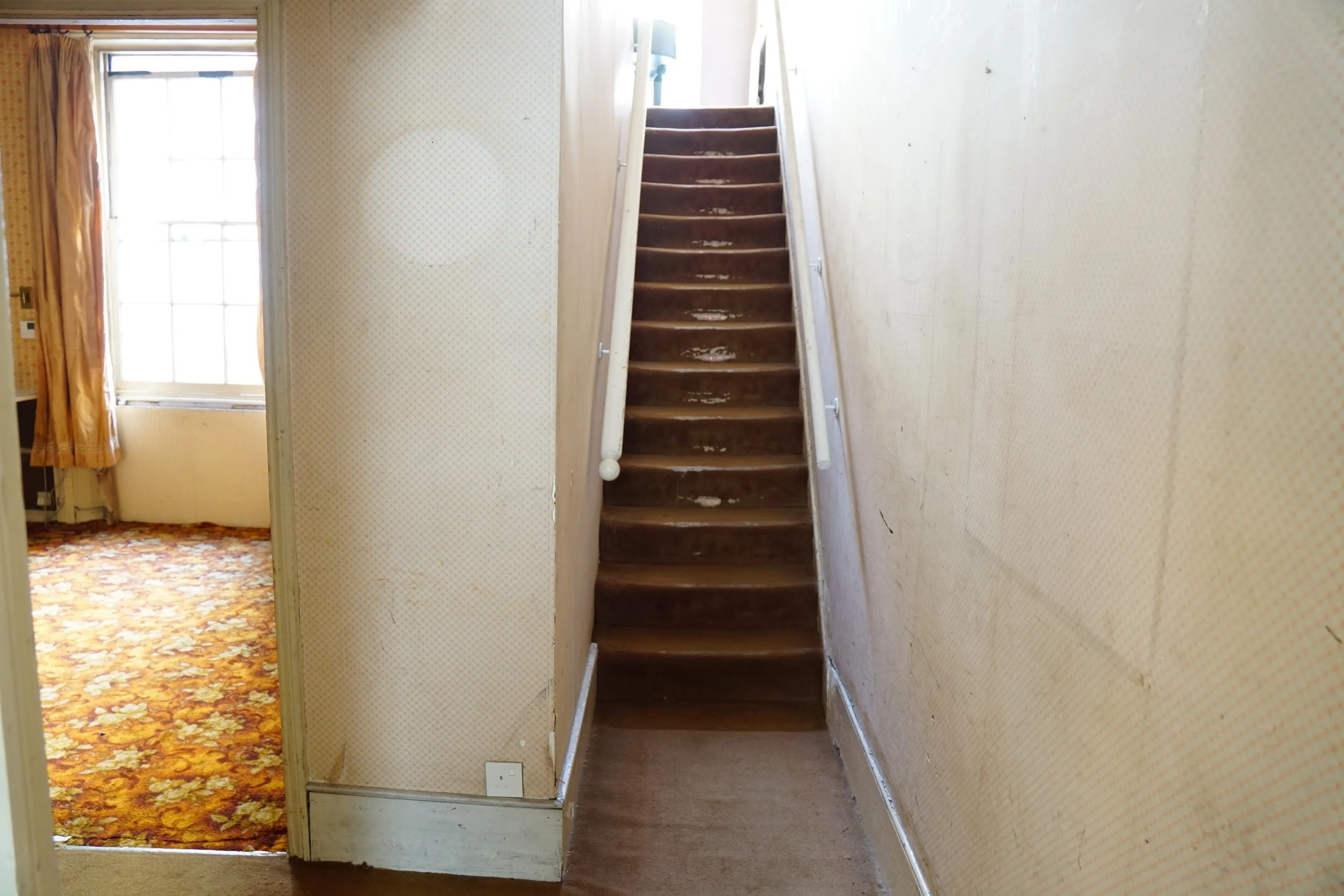 london-retro-distressed-white-stucco-terraced-house-unmodernised-filming-photoshoots-events-staircase.jpg