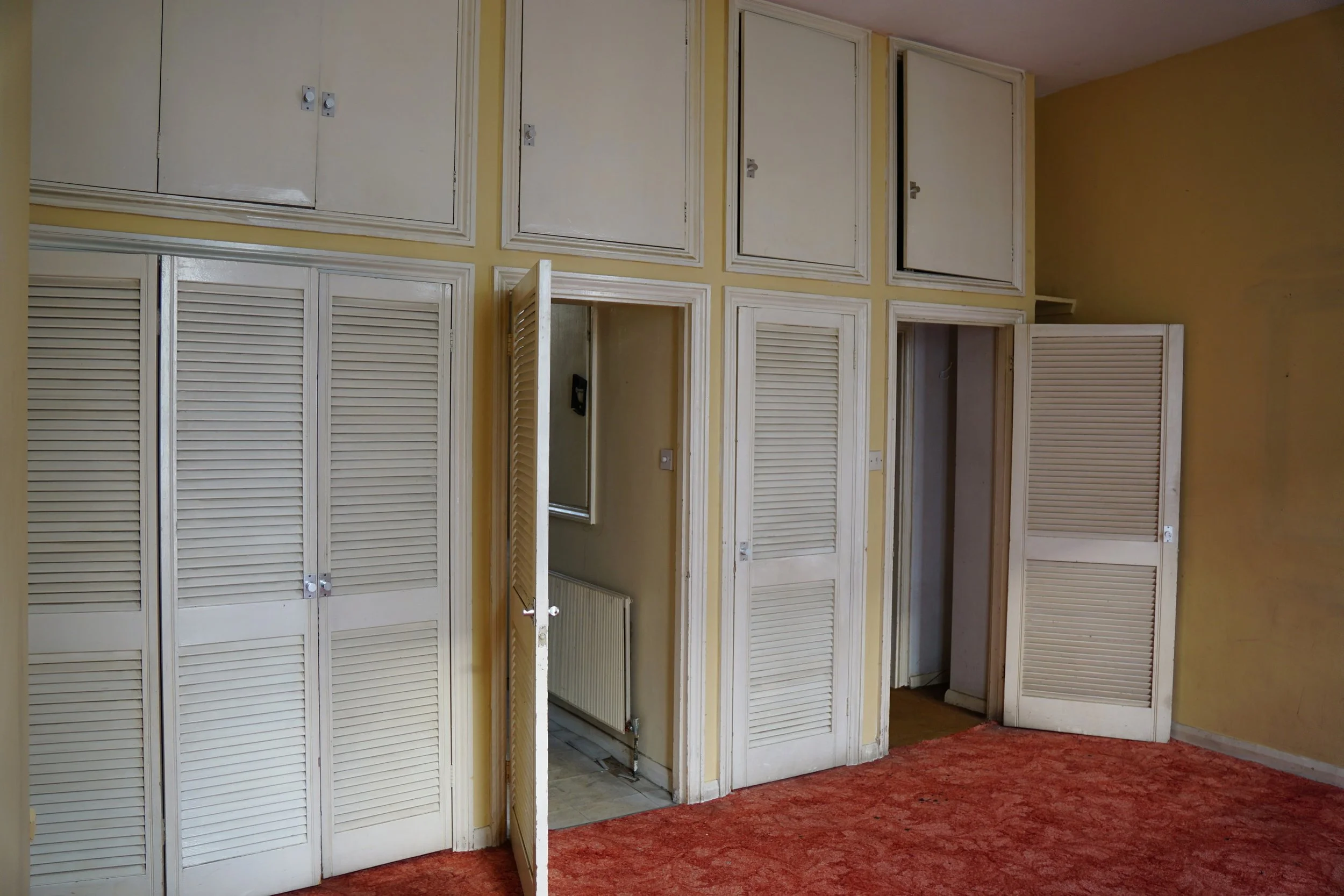 london-retro-distressed-white-stucco-terraced-house-unmodernised-filming-photoshoots-events-white-cupboards.jpg