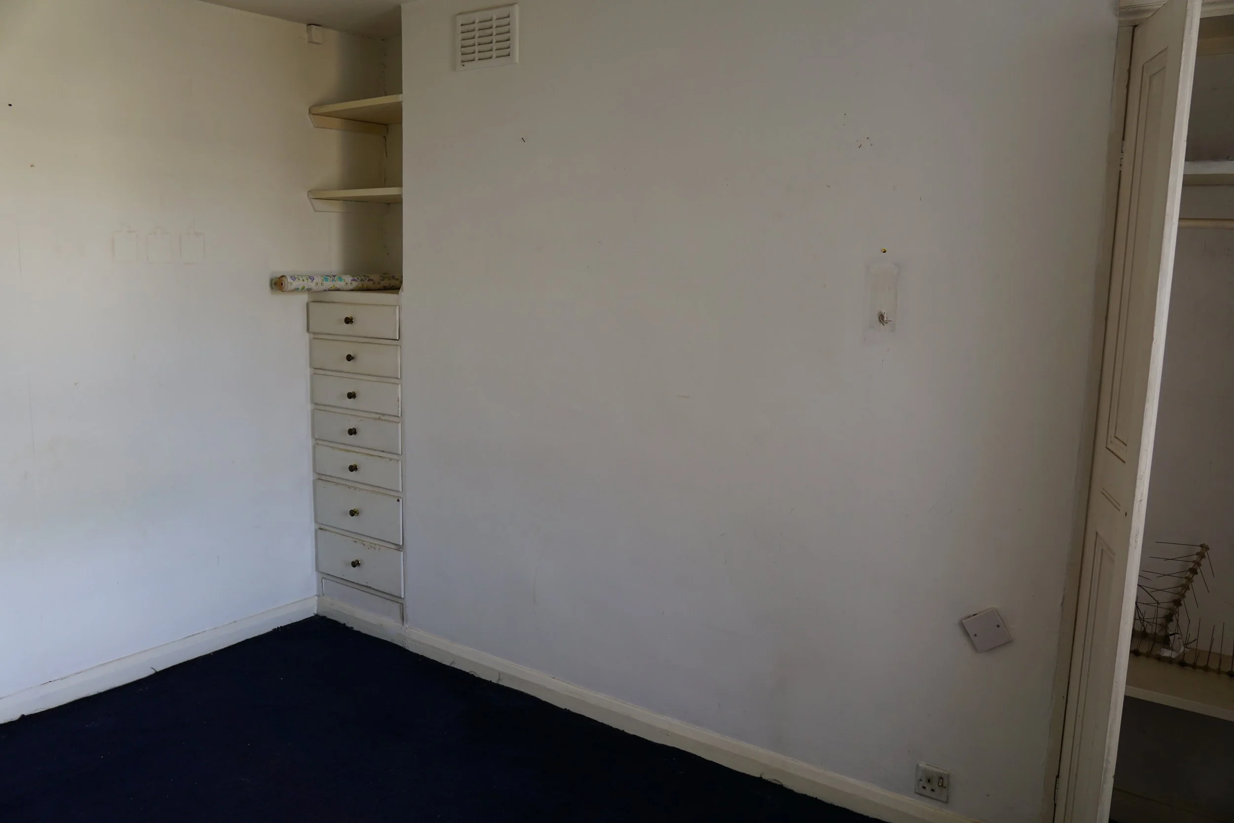 london-retro-distressed-white-stucco-terraced-house-unmodernised-filming-photoshoots-events-white-drawers.jpg