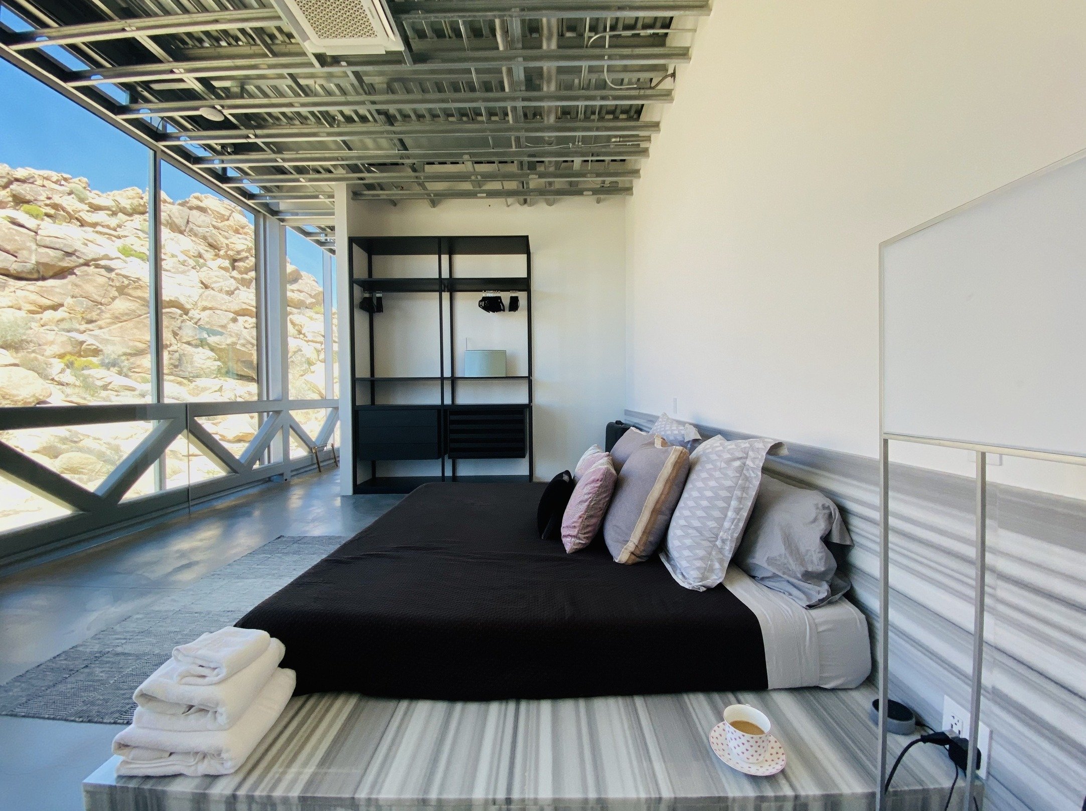 unique-joshua-tree-california-invisible-house-mirrored-horizontal-skyscraper-desert-architecture-filming-photoshoots-events-bedroom-lighting.jpg