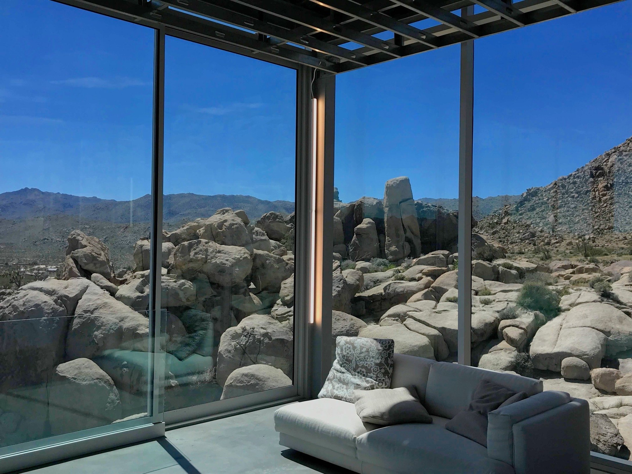 unique-joshua-tree-california-invisible-house-mirrored-horizontal-skyscraper-desert-architecture-filming-photoshoots-events-seating-area.jpg