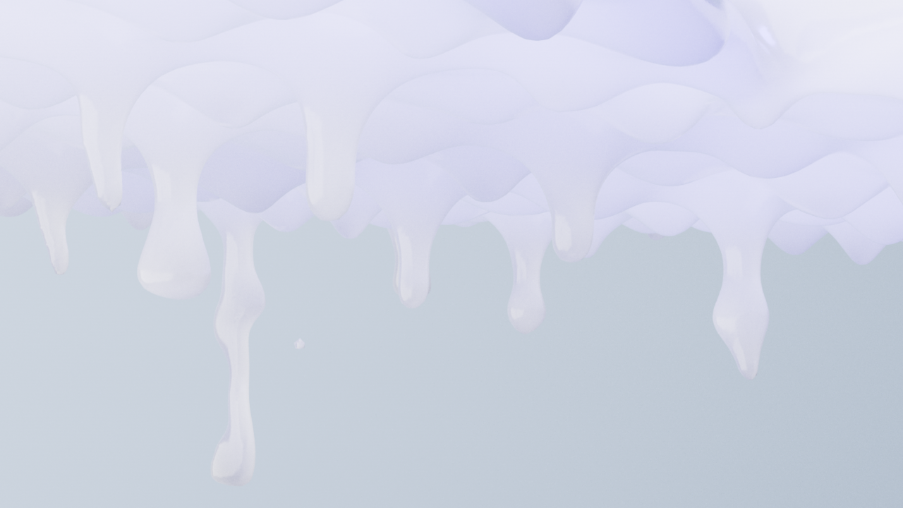 Close-up of white paint dripping from the edge of a surface