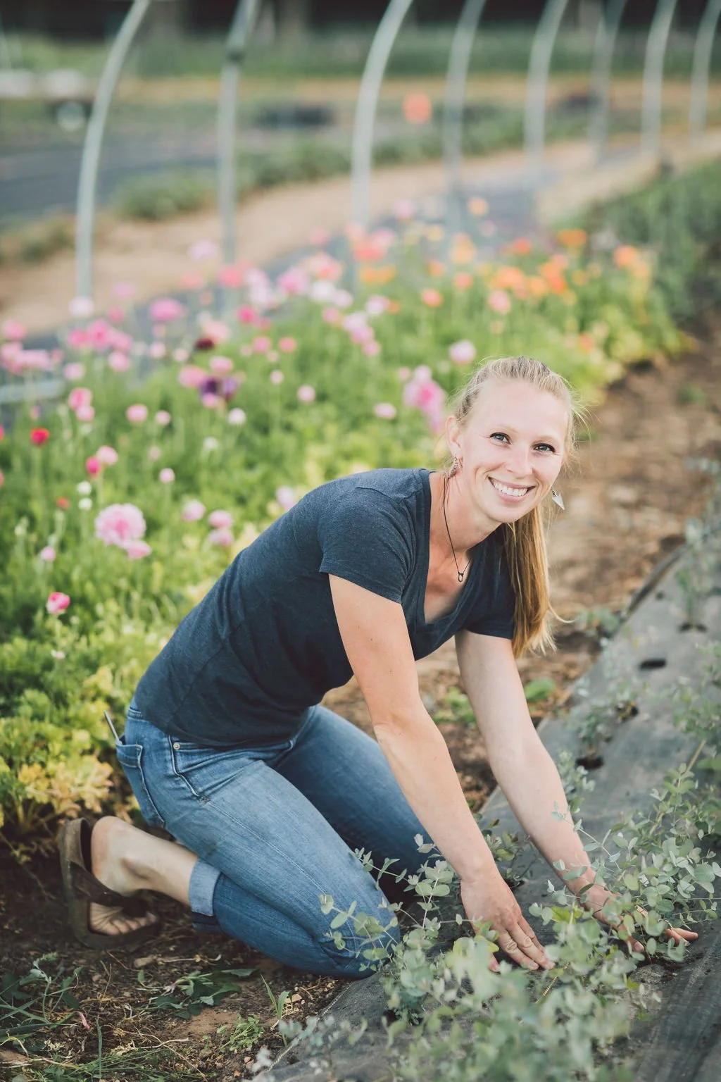 Jenny Marks, host of the Six Figure Flower Farming Podcast, is tending her flowers in a hoophouse. This episode goes over advice she'd give to herself back when she was a beginner.