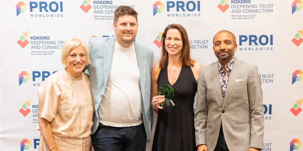A photo of Wildfire PRs MD and CEO with the PROI Award for EMEA Agency of the Year 2026.