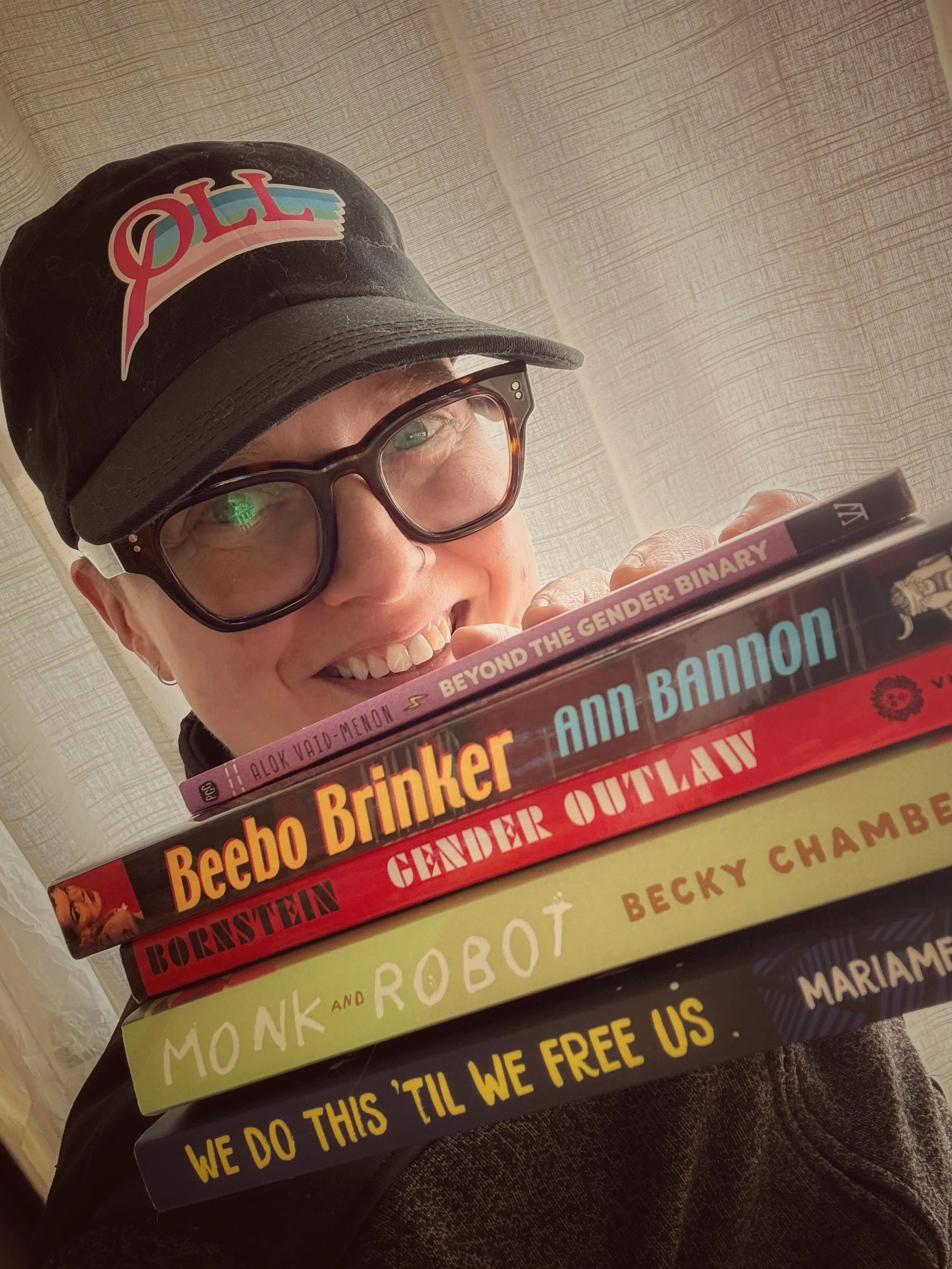 Happy banned books week! I am so proud of the work I get to do with the @queerliblib team making queer books accessible to everyone. 🏳️&zwj;⚧️💘🏳️&zwj;🌈💘

Librarians are fighting for your rights, yall! 🥊 

And this is your reminder to go sign up