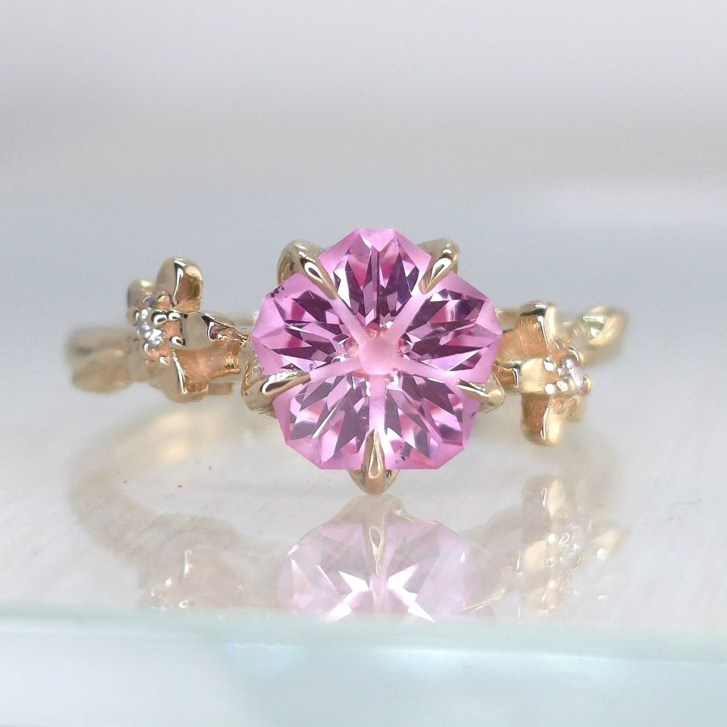 This beautiful 14kt gold piece was designed for a new client that wanted two asymmetrical cherry blossoms with leaves on a cathedral style ring. My client had a beautiful Hanami cut by @mvmgems and it's always my pleasure to set a stone by someone I 