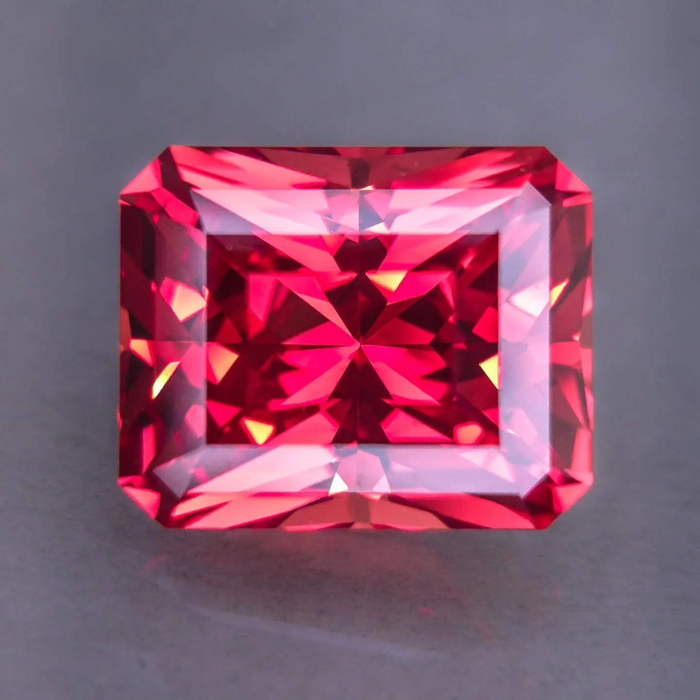 Available ❤️ 13.5 x 11mm - Insanely large &quot;Pad&quot; Titanium Czochralski pulled lab sapphire. Lovely reds, oranges and pink hues in this tone - difficult to pin down specifically but ovely altogether. Pink hues show in cool lighting whereas ora