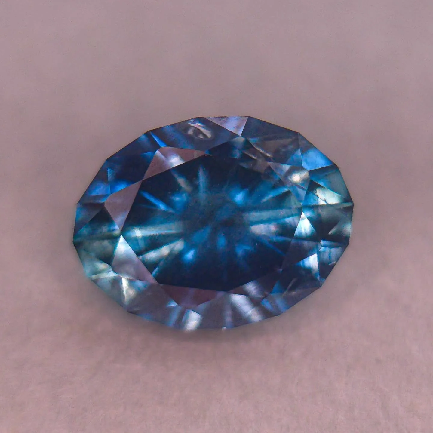 Available 🎇 This beautiful 1.8ct (8.3 x 6.2mm) peacock color blue/teal Montana sapphire hails from Rock Creek (heated). My largest sapphire ever to date! Cut in Omni Oval, a very sparkly classic oval cut that has a great starburst pattern on the pav