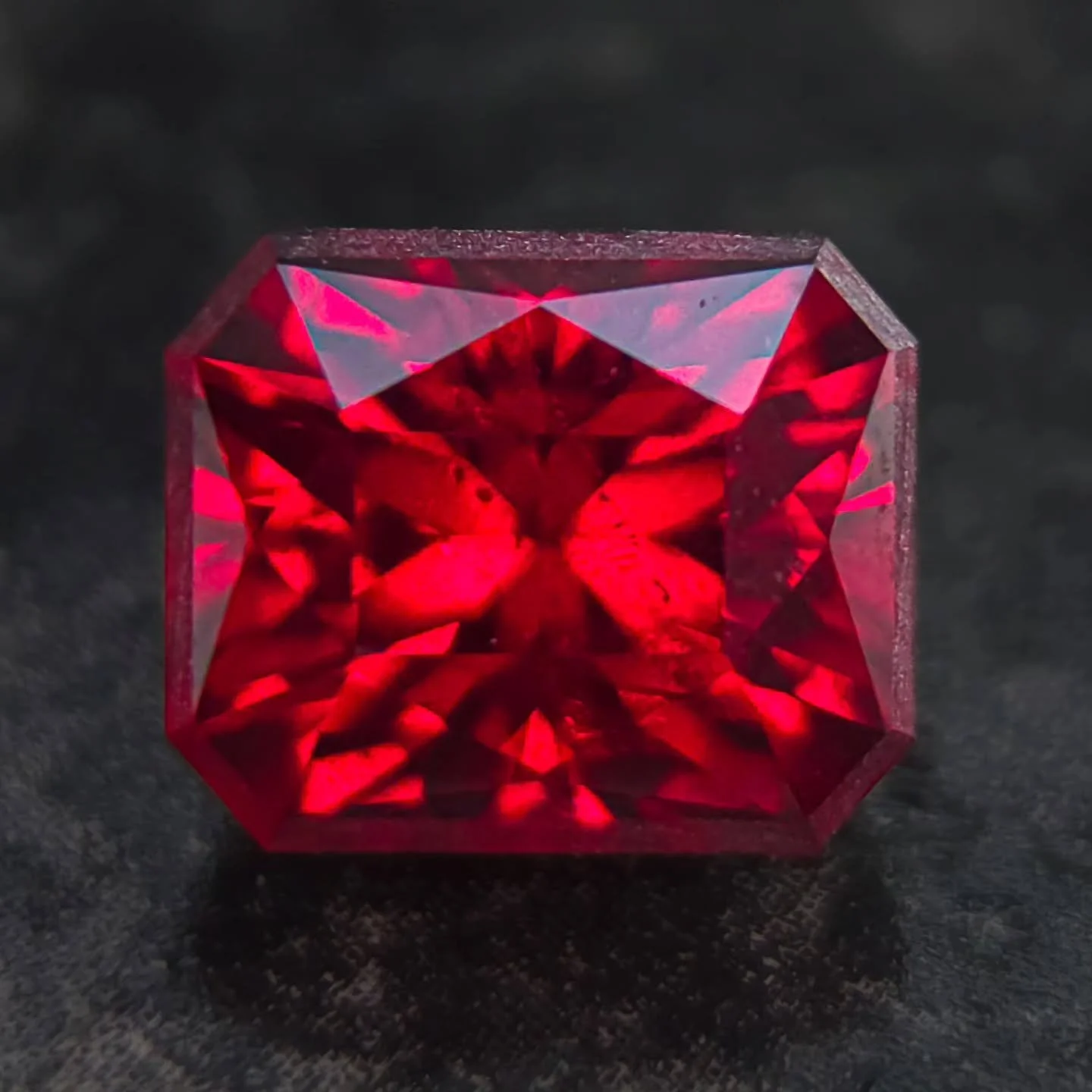 Another beautiful stone cut for @anzagems. This is a stunning deep red Rhodolite, cut in Ramon Tesoros design The Octopus. That frosted frame? It's intentional! It's designed to bring contrast to a darker gem color, which I thought would be fun to ad
