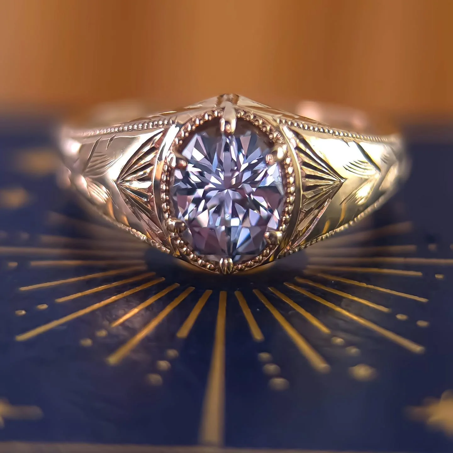 Available ✨ This beautiful hand engraved piece is one of my favorites to date. A beautiful 1.43ct cut by @sloanestonez - fantastic sky blue color, spectacularly clean and sparkly and looks incredible in yellow gold. Size 6.5 usa - leaf and milgrain d
