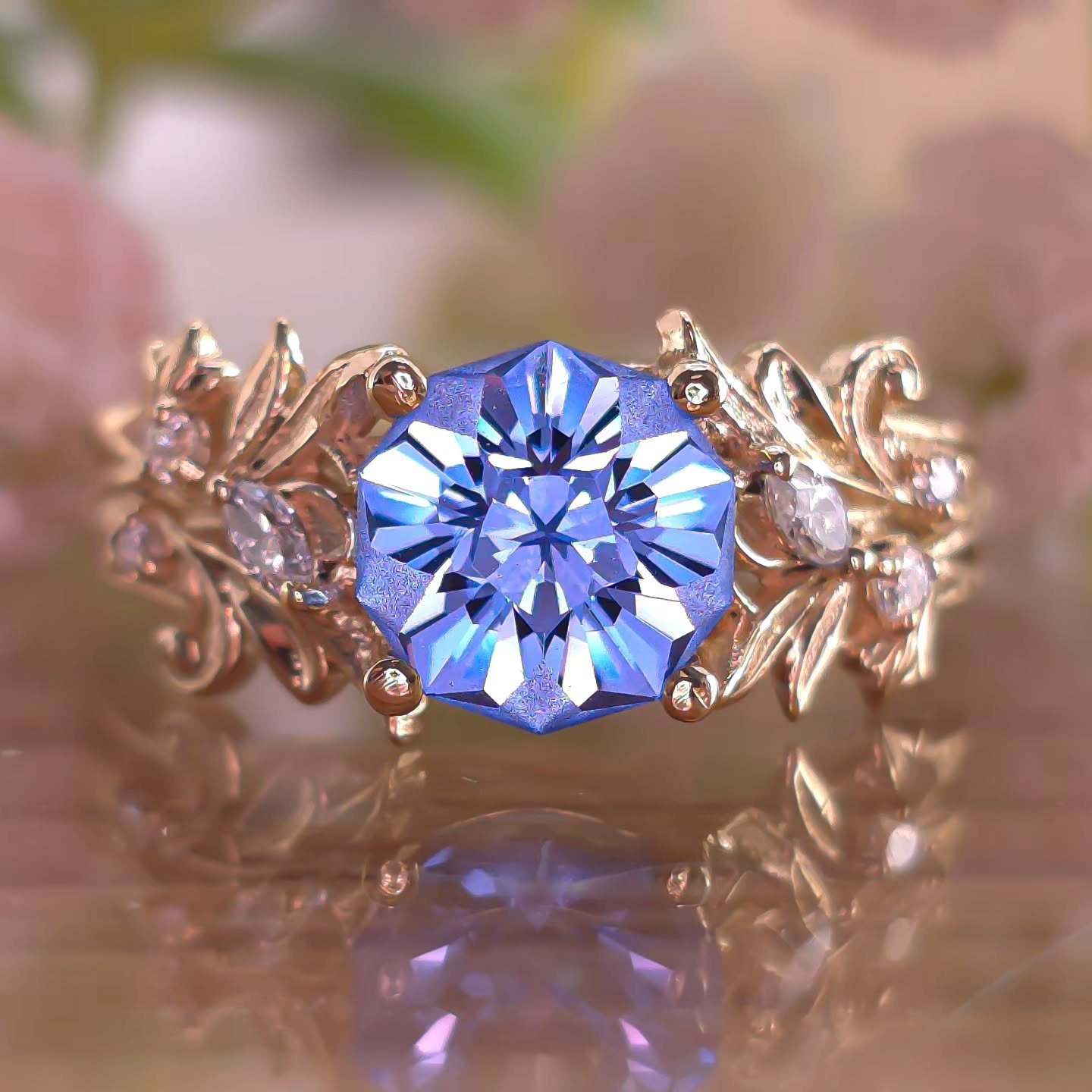 A staple here at the studio 🏵️ 14kt Yellow gold Asymmetrical Leaf Ring with my iconic Hibiscus gem design, with lab diamond accent stones nestled in leaves. I have never gotten tired of making this piece, and I have made many of them, and plan on ma