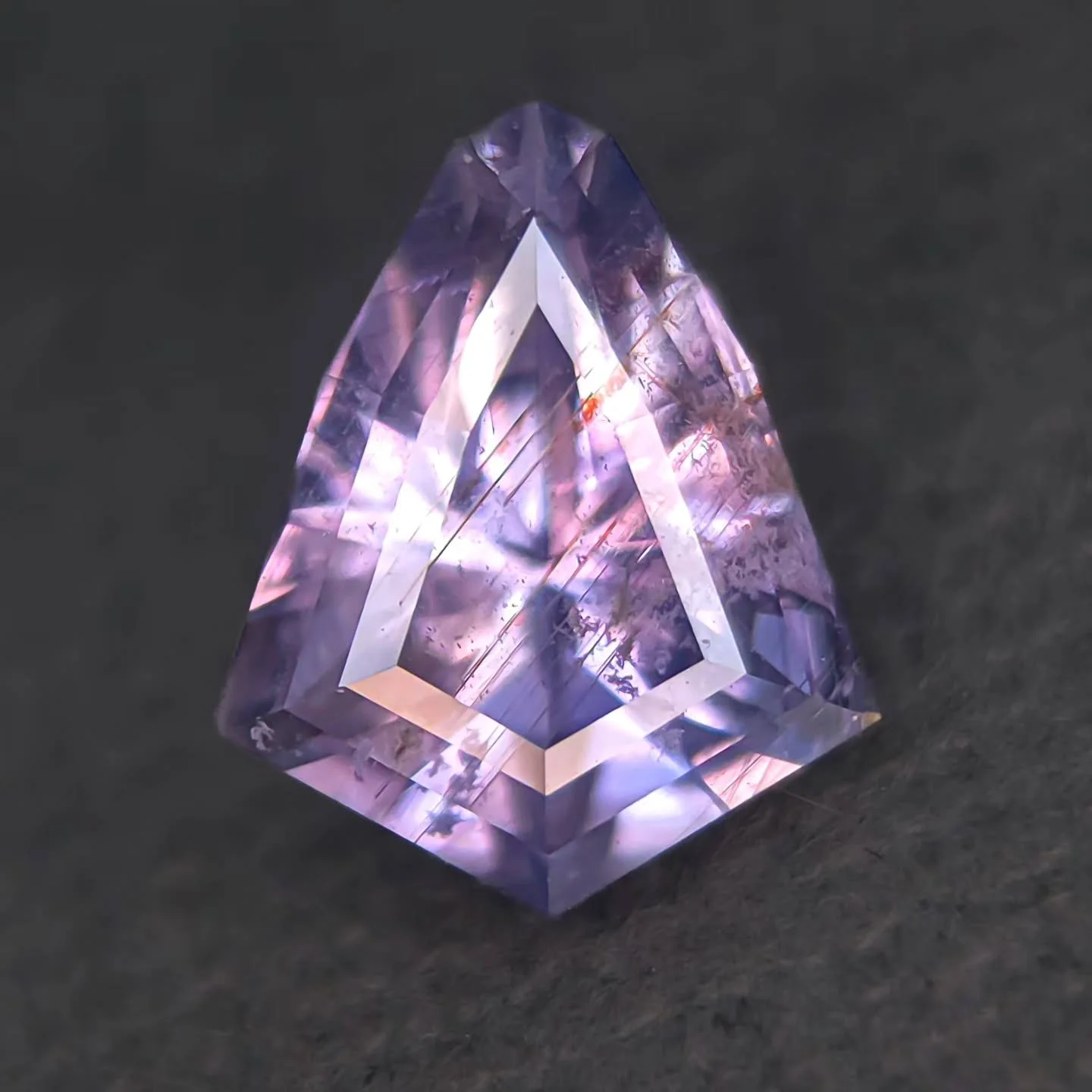 Sharing this beautiful natural Sapphire I cut for #anza gems which is available through them ✨ 3ct, 11 x 9.5mn - Stunning color and beautiful natural Rutile inclusions under the table and great sparkle. A super unique sapphire, spectacular purple lav