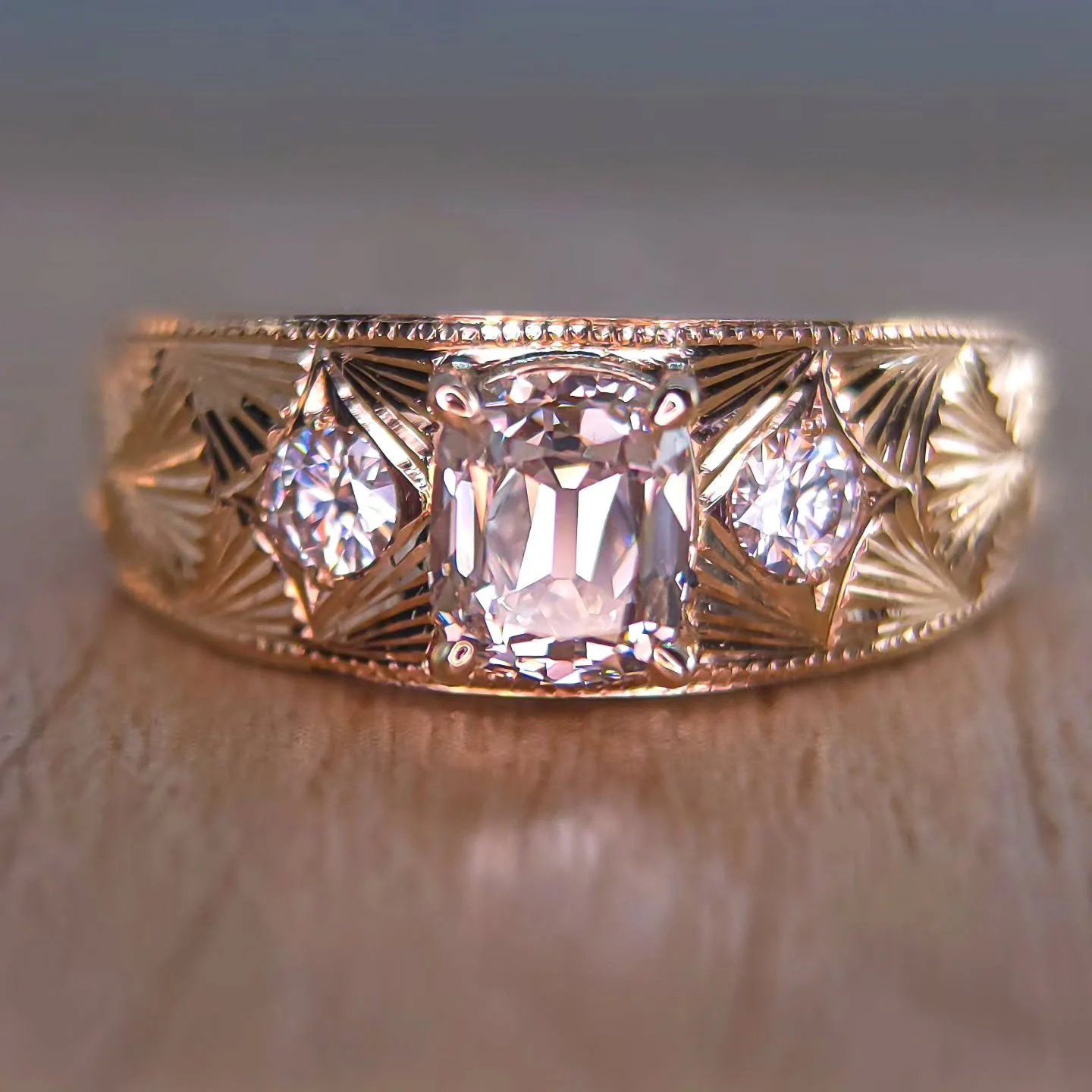 In case you missed it ✨ This completely hand engraved piece is on solid 14kt yellow gold, with a beautiful light brown K- 1ct natural diamond. Features two diamond round accents, embedded with fan leaves and milgrain. This piece is a size 6.5 USA but
