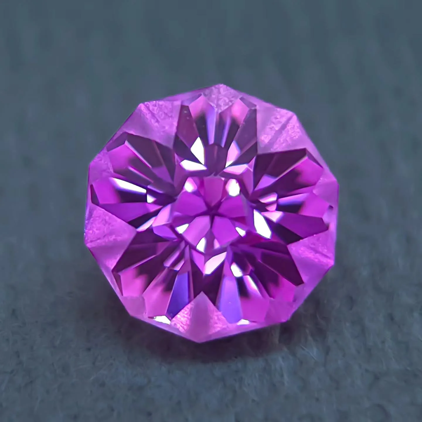Available ✨ 7mm Lab Sapphire cut in my iconic Hibiscus design. Pinkish purple color, super cute and would be perfect for a dainty setting. 
Snatch it up on my website - RanaLevyJewelry.com

#labsapphire #labgems #purplegem #floral