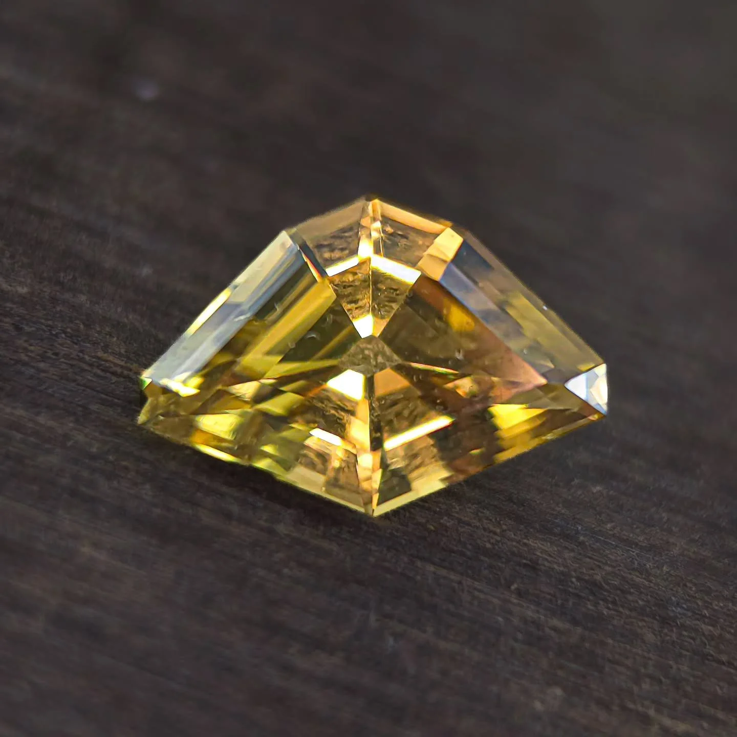 This was a fun one for @anzagems. Yellow/green Tourmaline in a freeform symmetrical step cut. 9 x 7mm, 2.31 ct, very clean. The rough was so clearly a squat triangle, it just had to be done this way 😎 I don't always enjoy doing freeform but they are