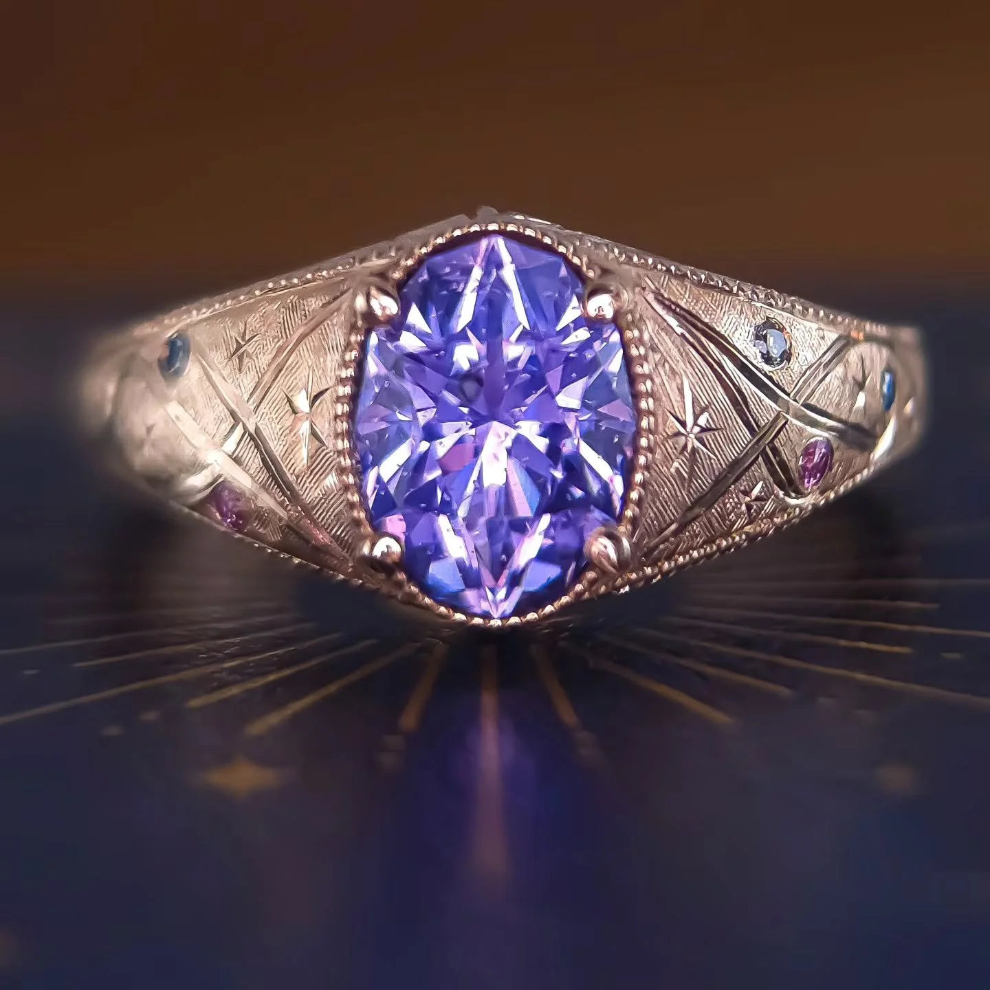 She's ready ✨ I've been working hard on this release! 14kt solid yellow gold with a 1.8ct Unheated Sapphire, cut courtesy of @sloanestonez
Colored diamonds are encased in hand engraved celestial swirls with stars, overlaying a Florentine finish with 