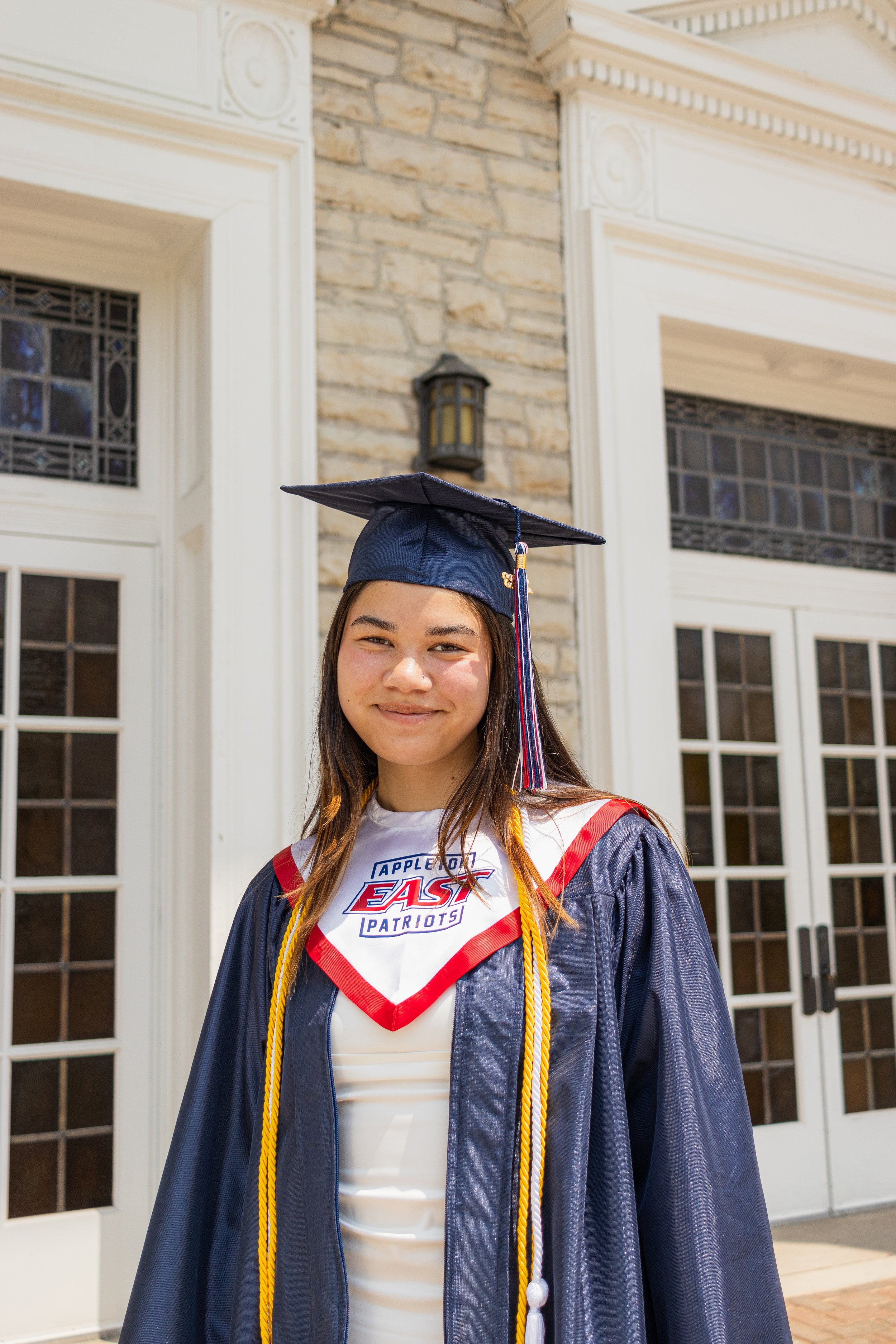 photo of recent high school graduate in front of chapel in appleton wisconsin