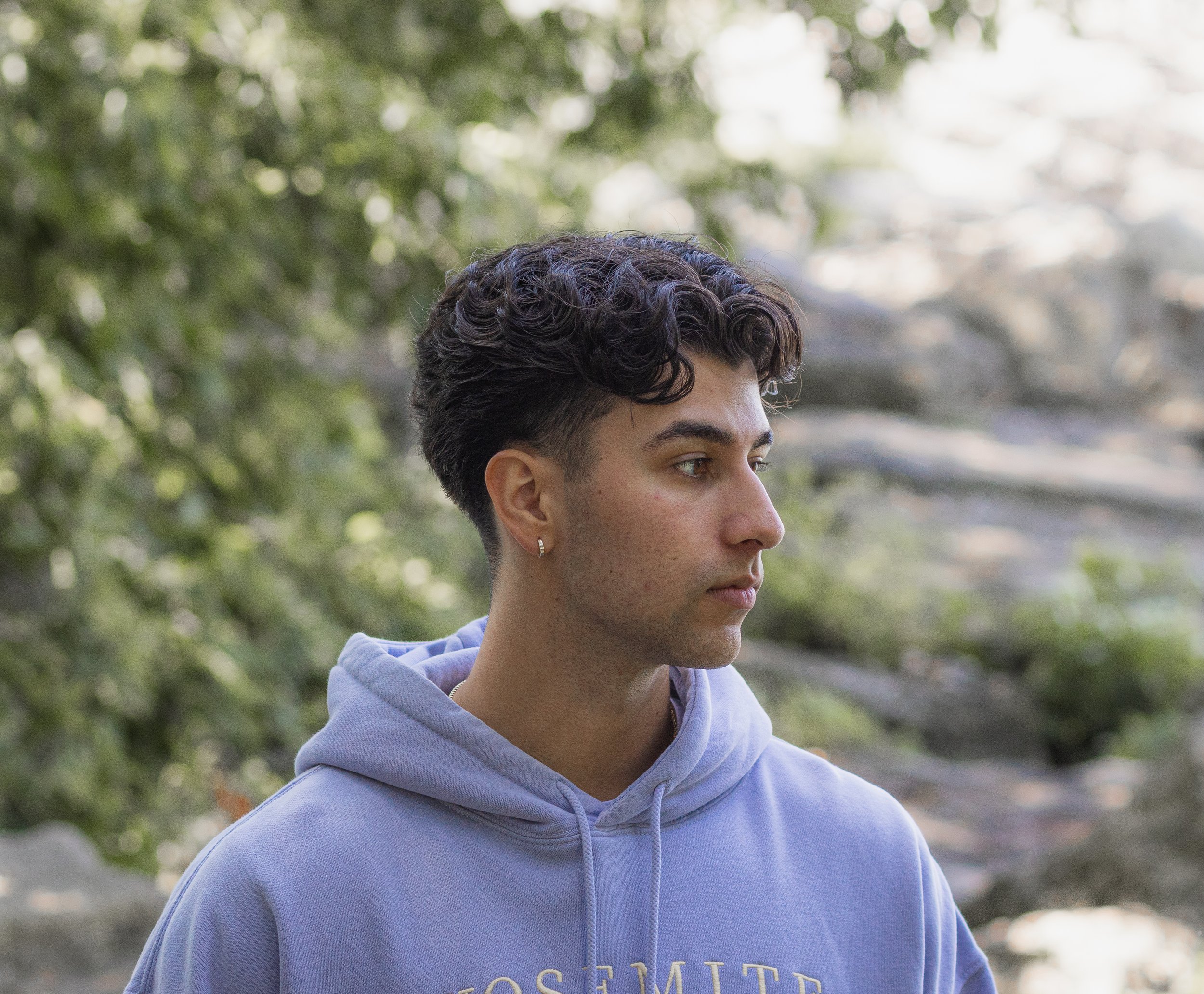 moody photo of man posed up in high cliff state park in wisconsin