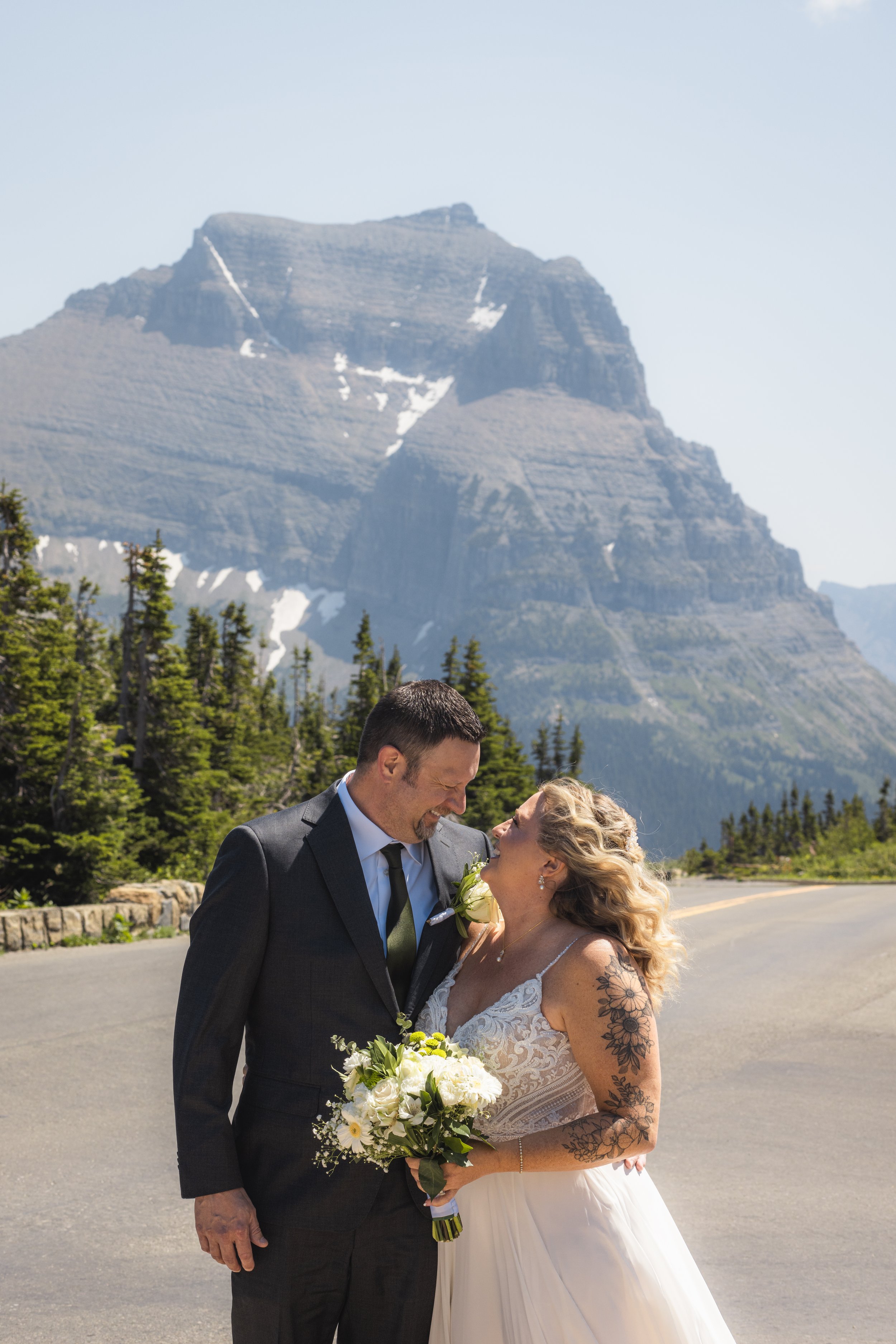 photo of couple looking at each other, elopement in glacier park in montana