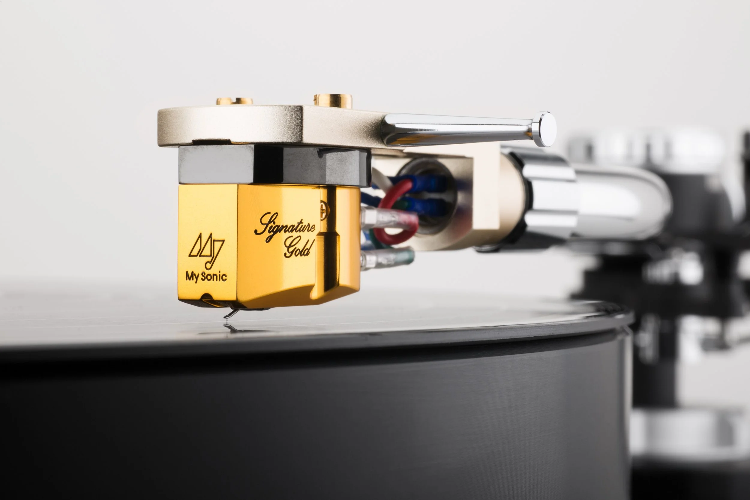 Gold My Sonic Lab phono cartridge on silver